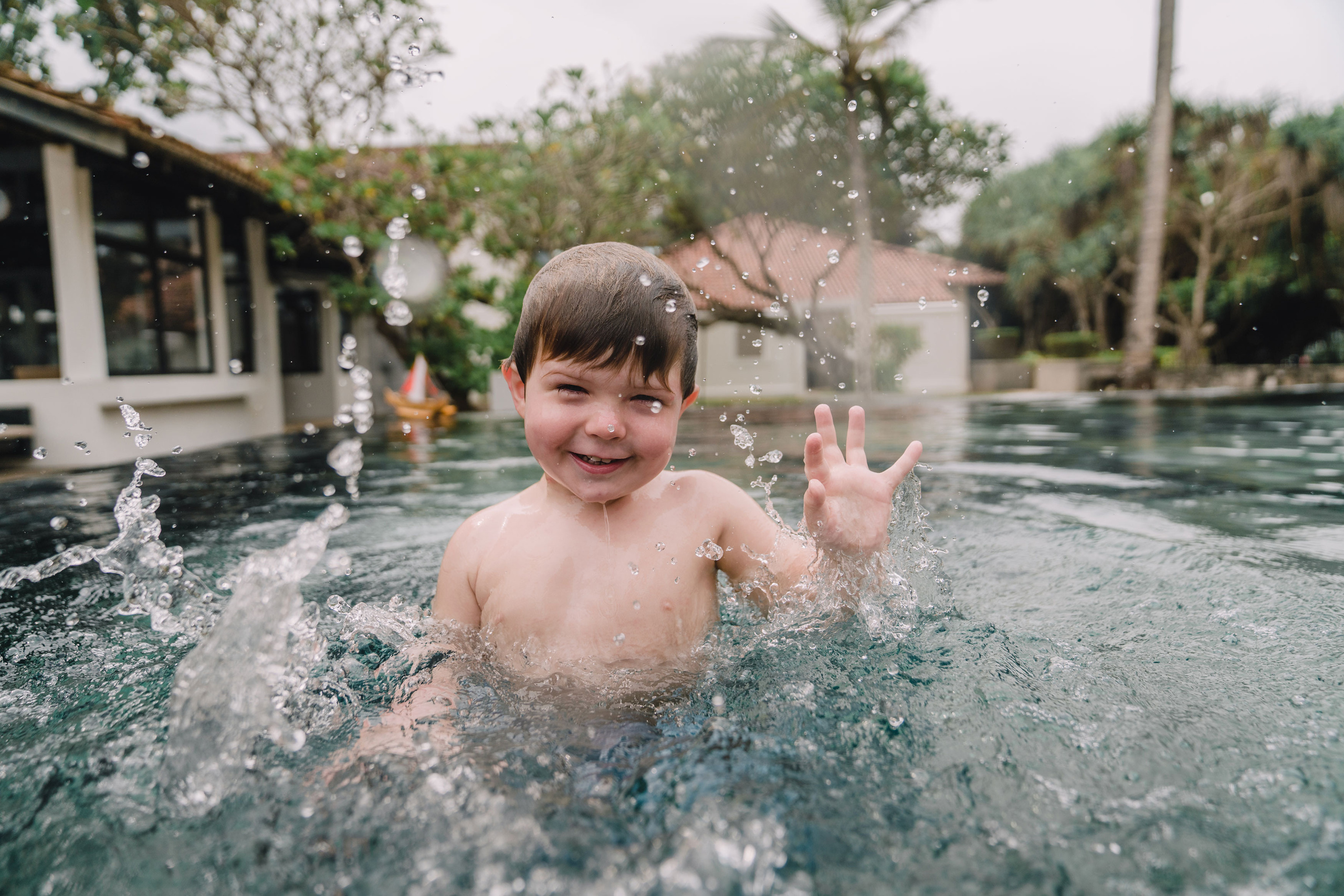 A boy chilling in a pool