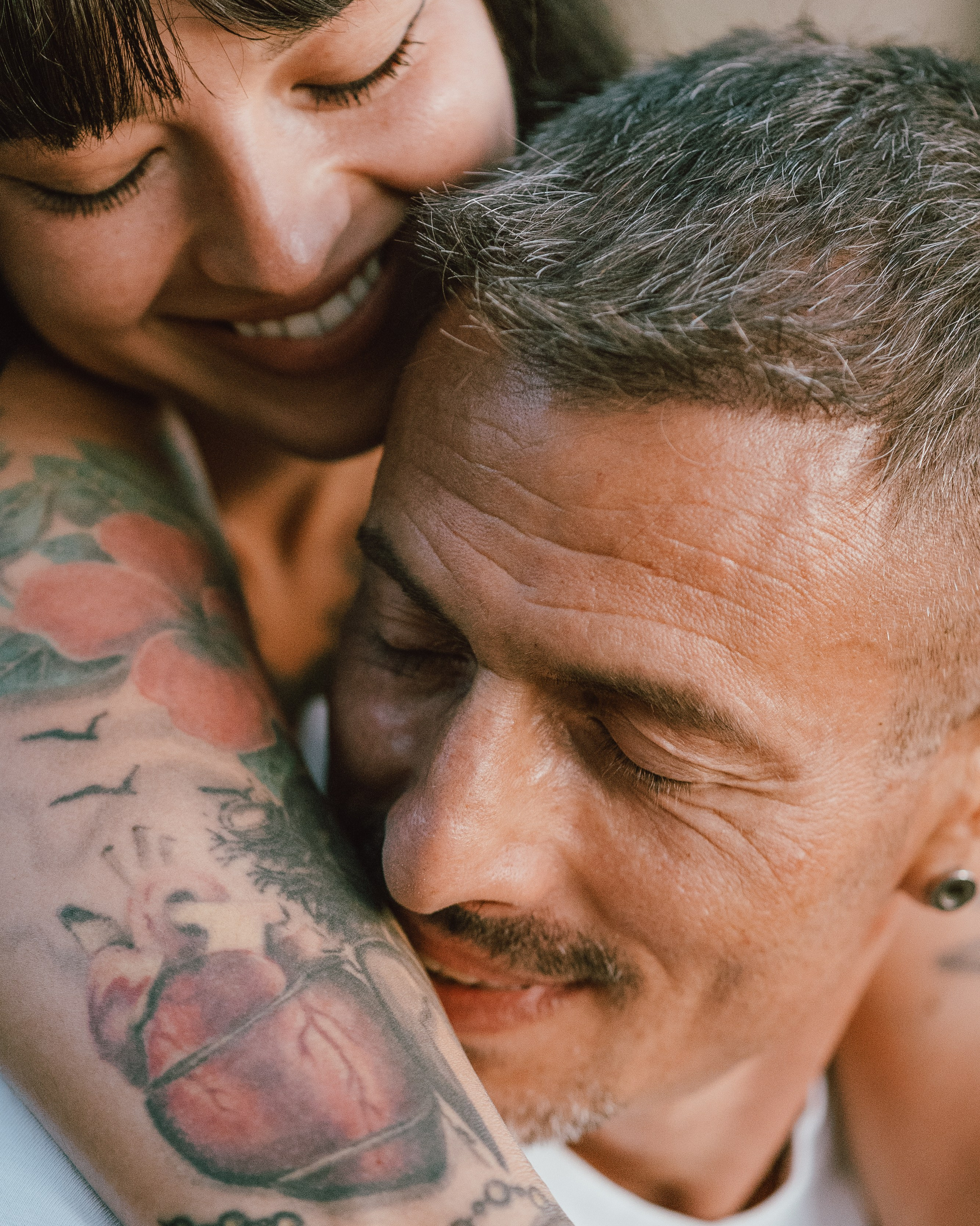 Emotional couple after proposal, romantic engagement photography capturing authentic reactions