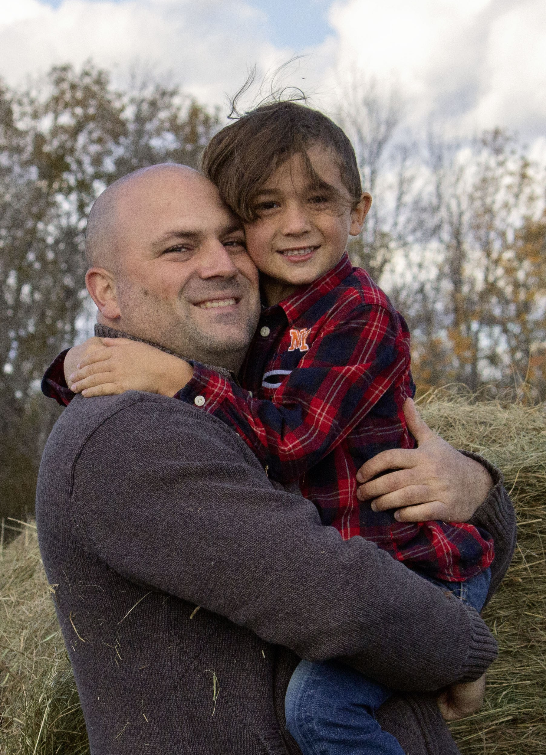 Father holding his child during a fall family photoshoot in Calgary