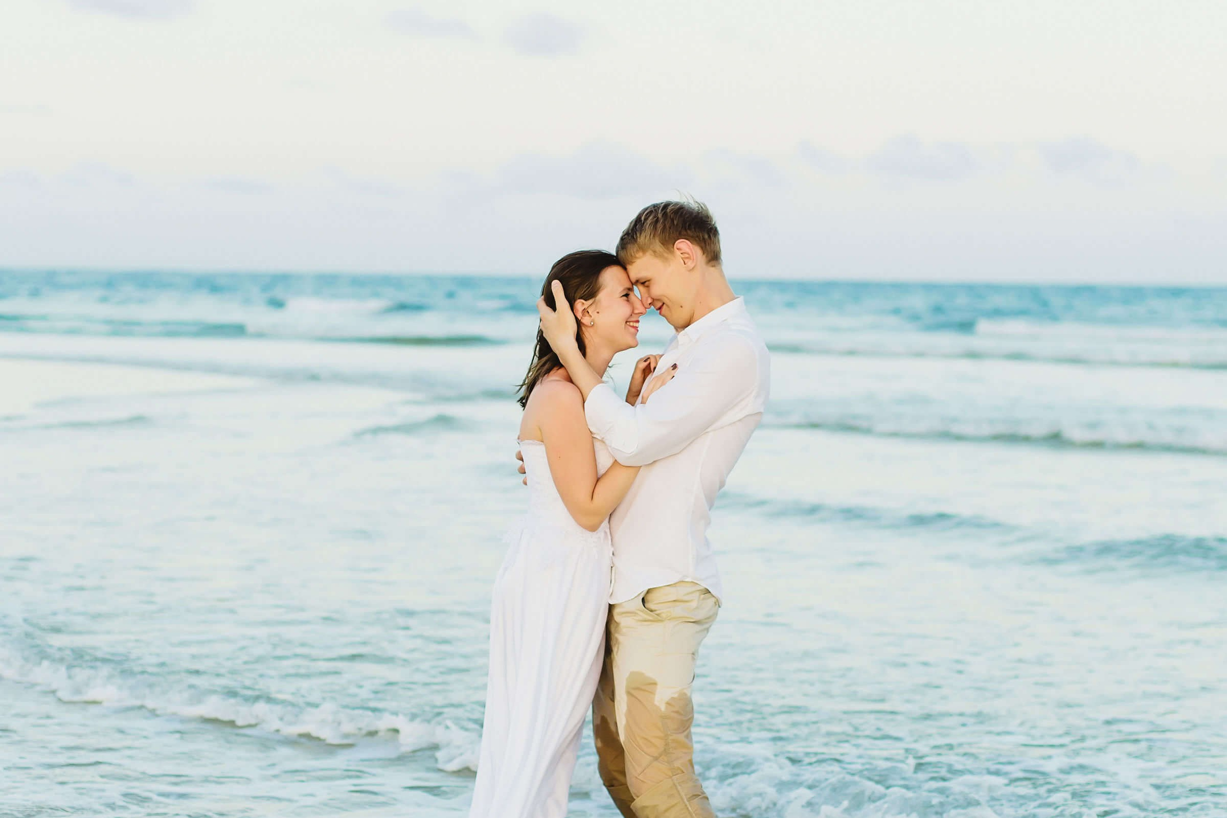 Joyful ocean embrace at Diani Beach. Maiafreia Studio captures Russian couple post-wedding moments and honeymoons with coastal serenity in Kenya.