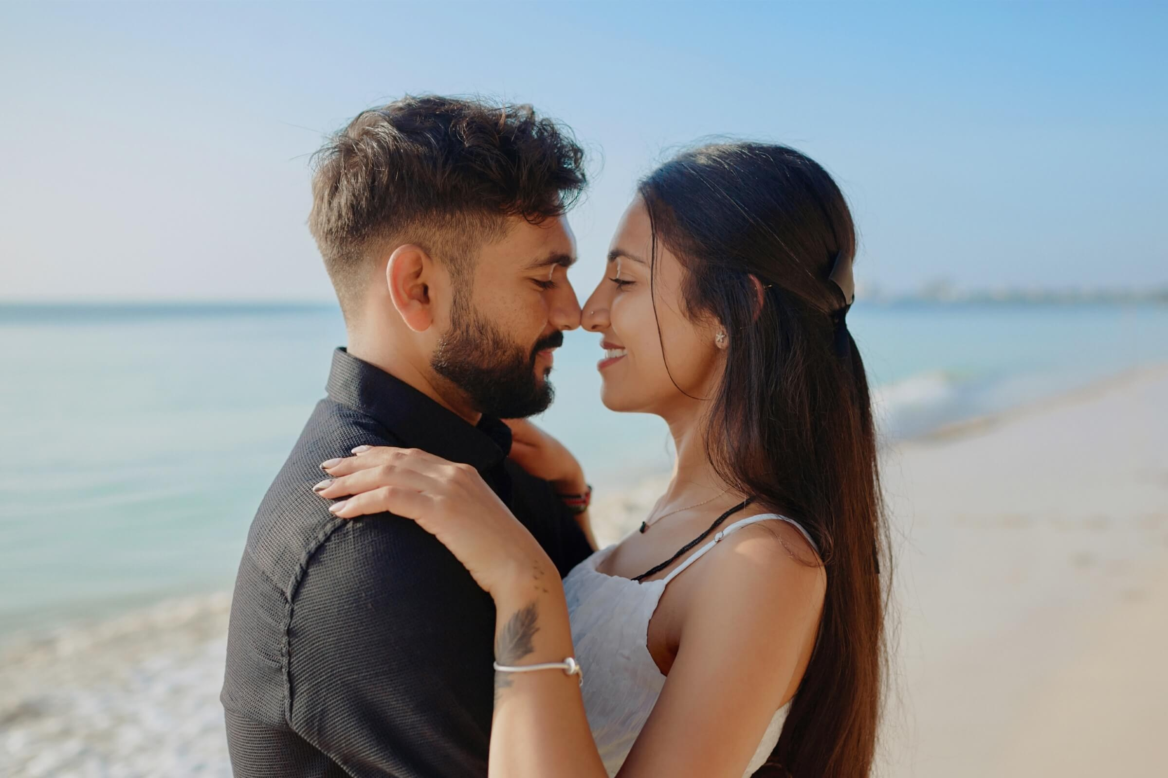 Romantic beachside Indian couple portrait at Sarova Whitesands Mombasa. Captured by Maiafreia Studio, where love and luxury meet for unforgettable Kenyan wedding and engagement photography.