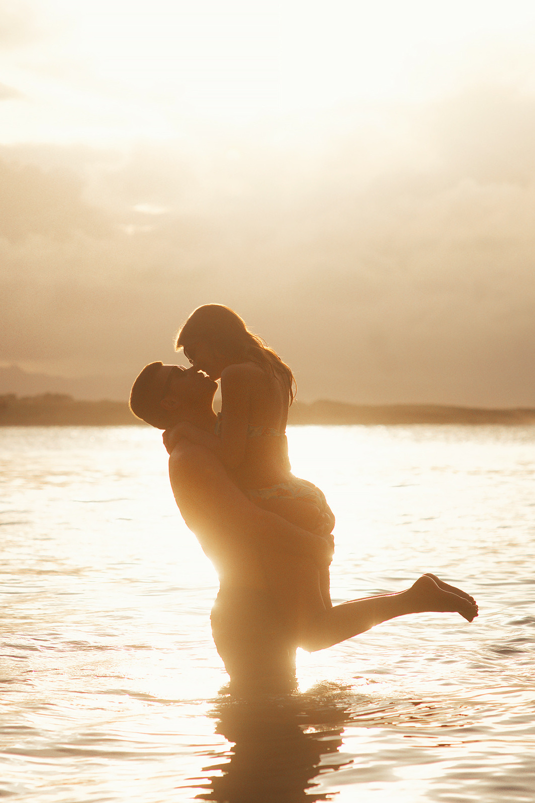 Romantic couple walking hand-in-hand along the beach of Dominican republic