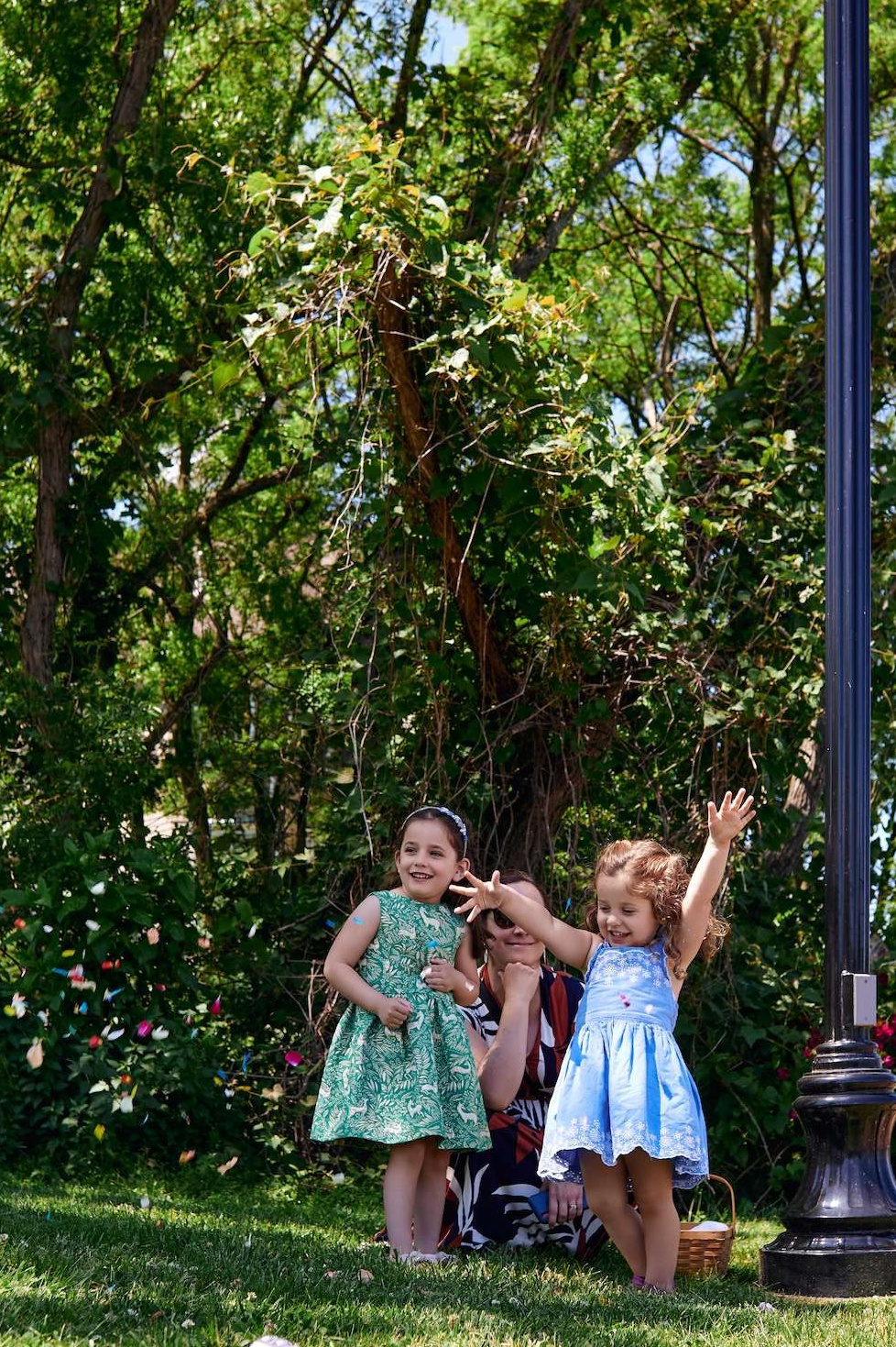 Family enjoying a photoshoot on a park lawn