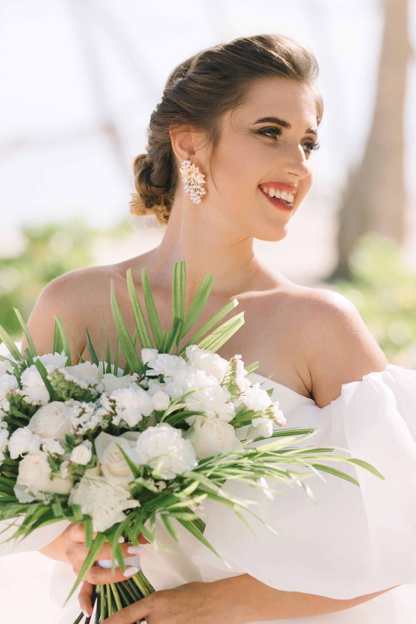 Romantic wedding couple under palm trees in the Dominican Republic
