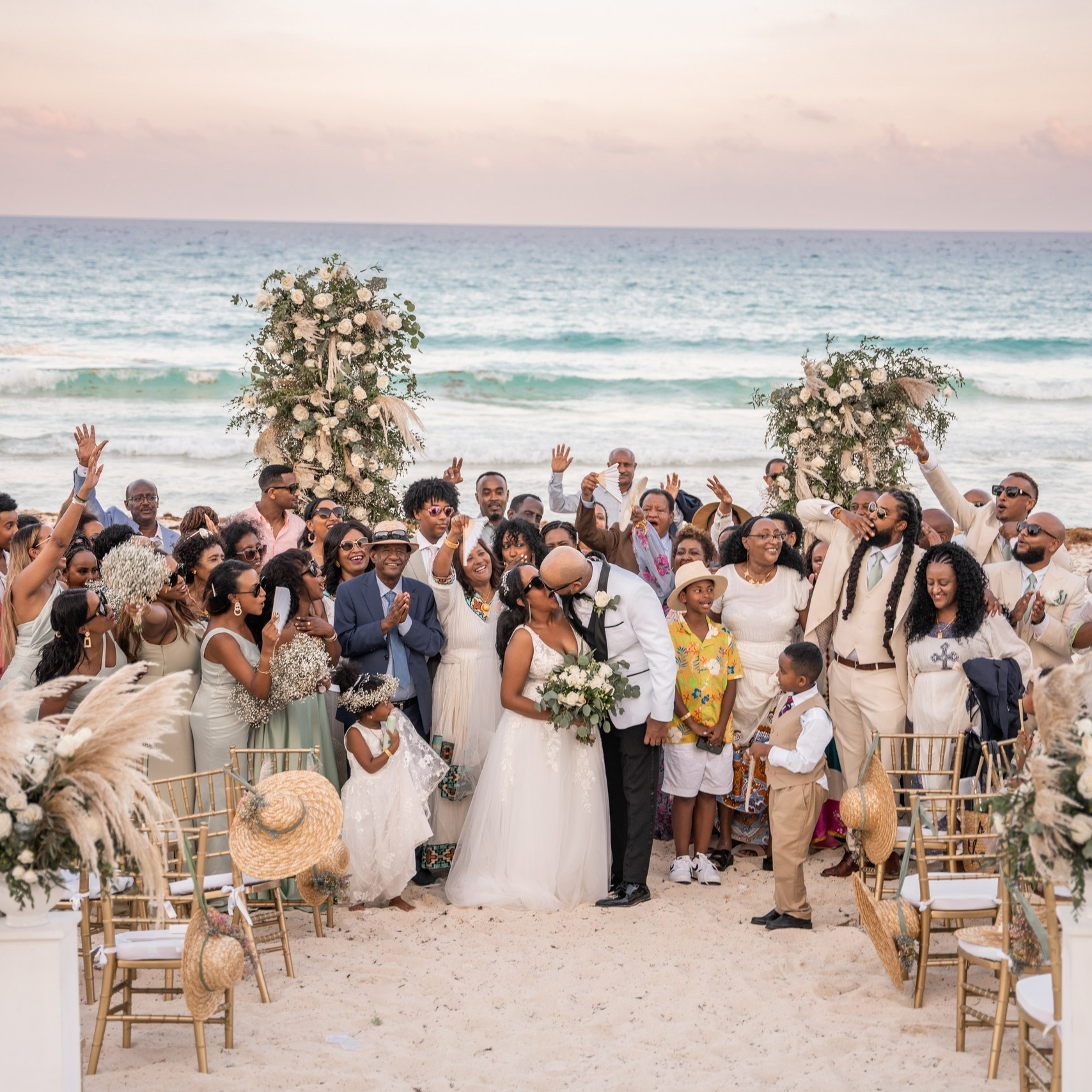 The bride, groom, and friends at a wedding in Playa del Carmen.