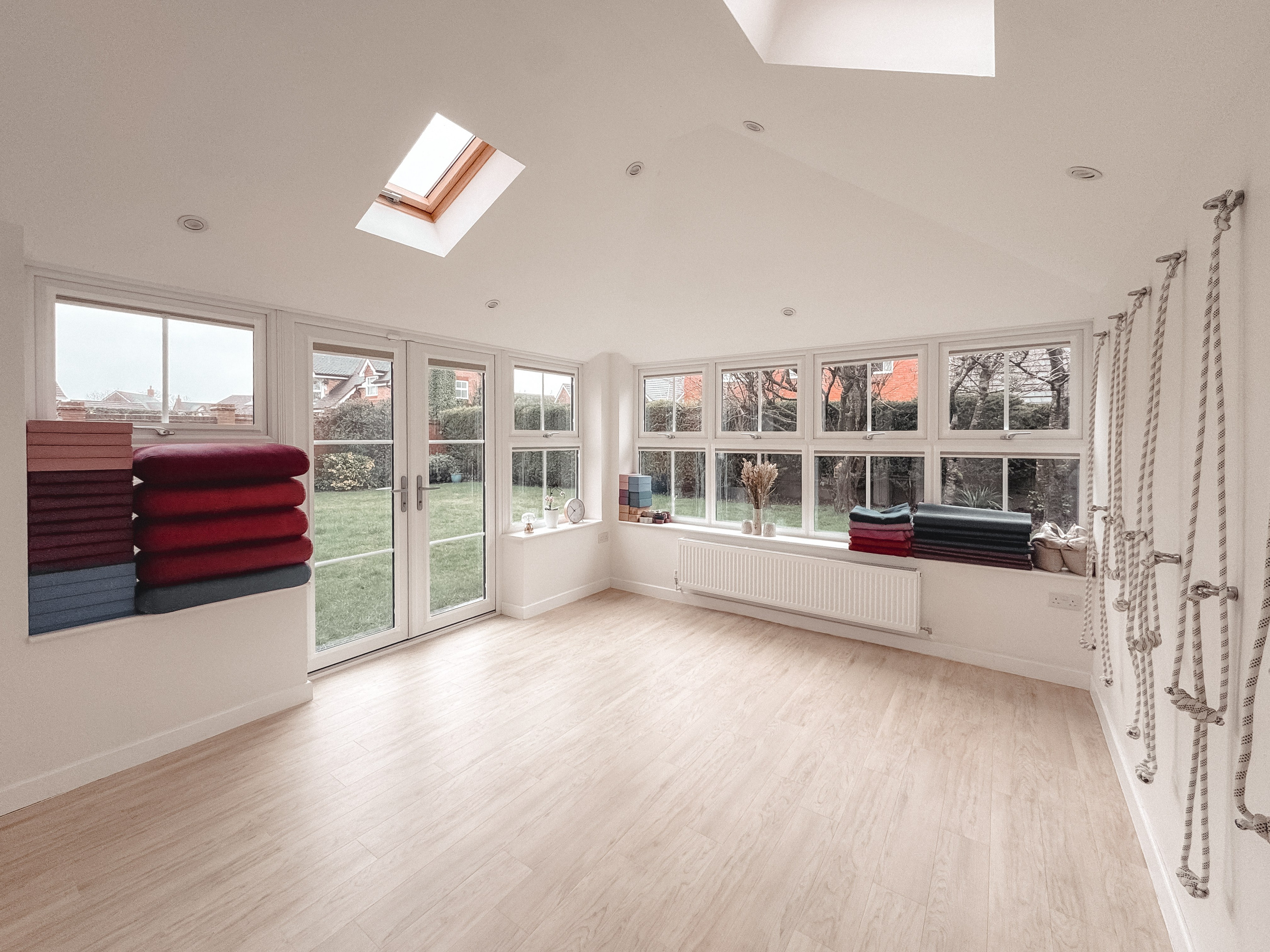 Iyengar yoga home studio in Solihull with natural light, garden view, mats and props prepared for private and small group classes