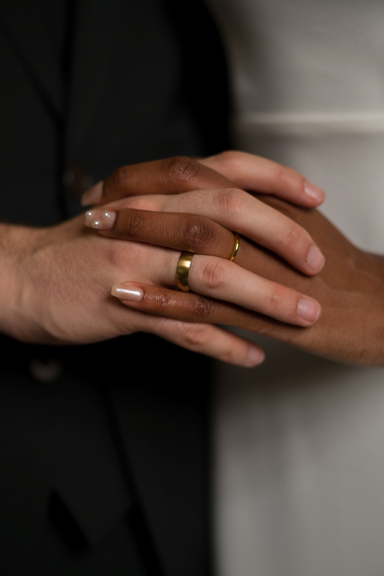 Groom gently holding the bride’s hands inside City Hall