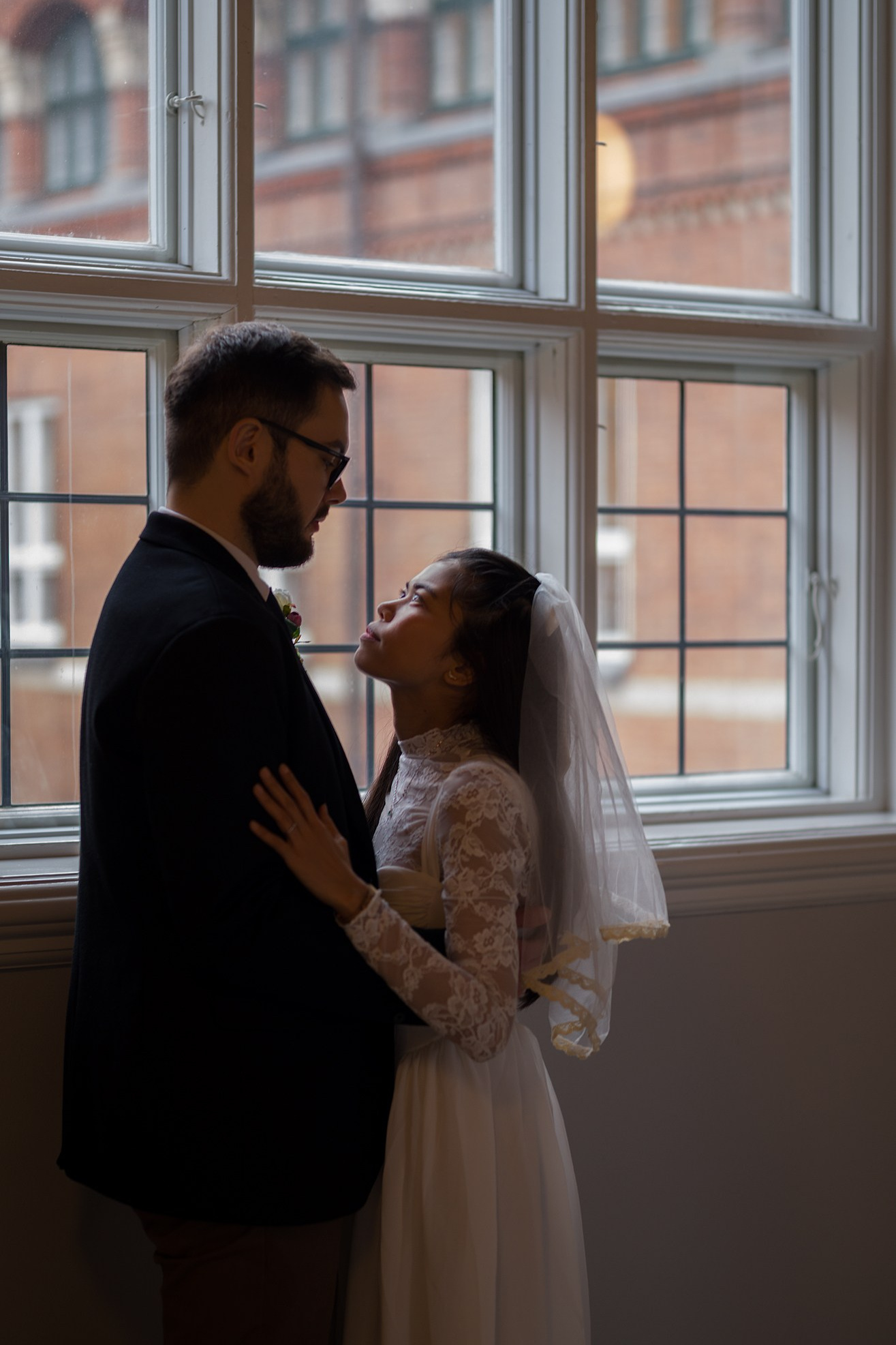 Loving couple sharing a happy moment in Copenhagen City Hall