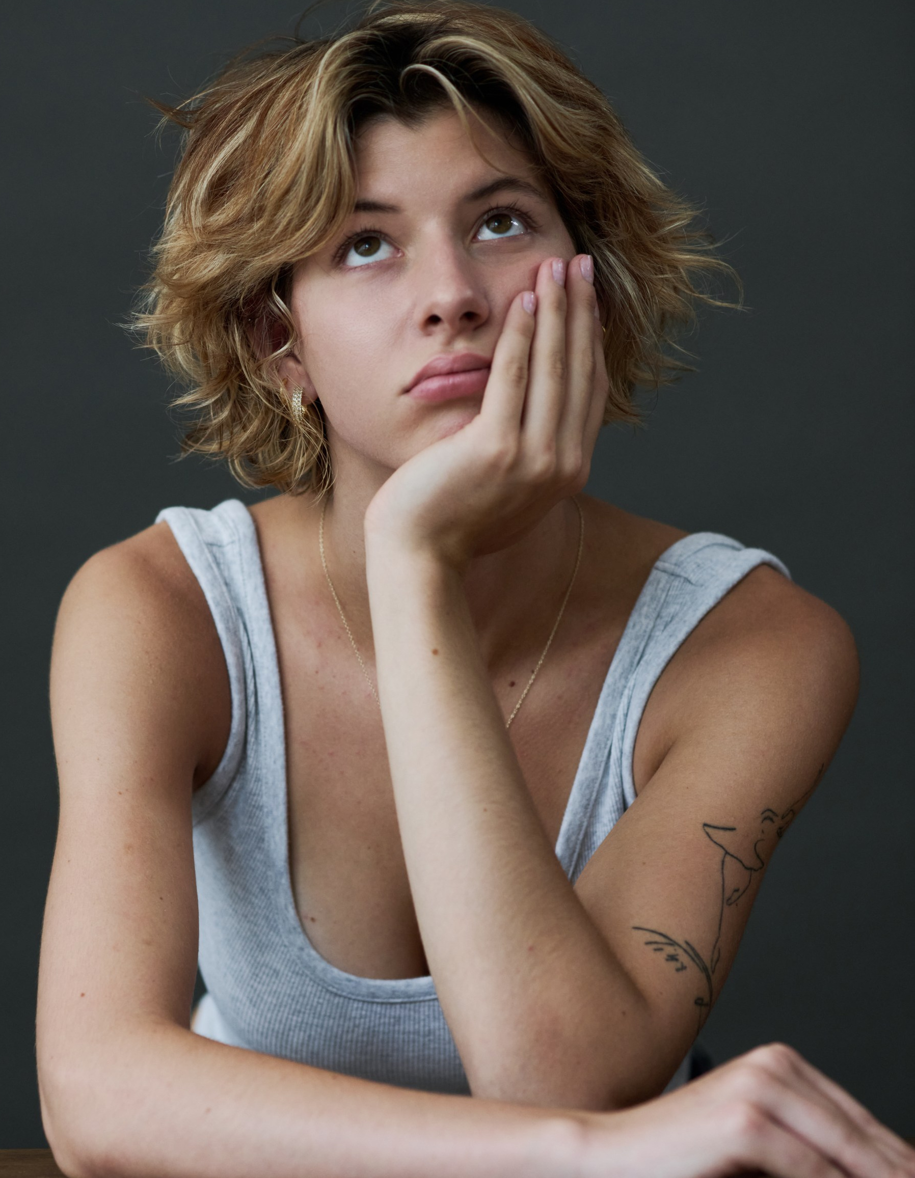 Portrait of a girl with curly hair by Award-winning portrait Photographer Victoria Ushkanova,