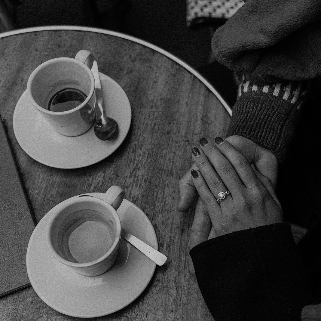 Couple engagement photo shooting in one of the most iconic cafes in Paris