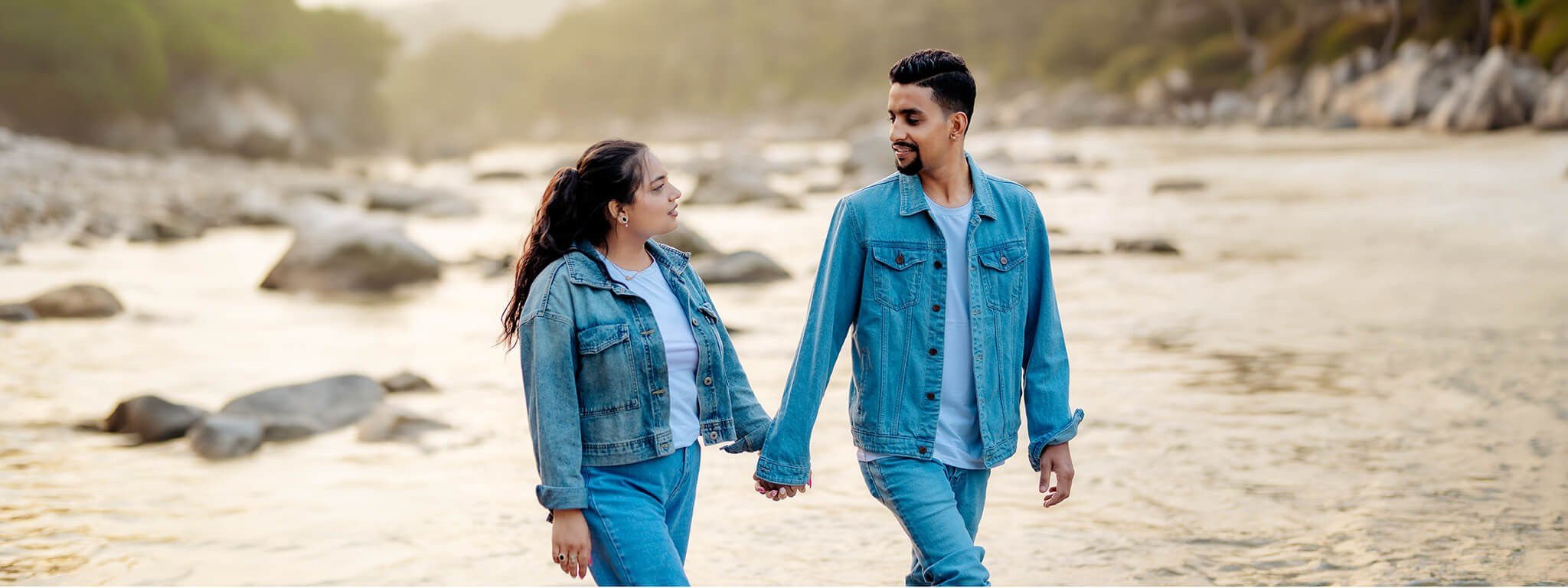 A bride and groom walking hand in hand during their pre-wedding photoshoot in Nepal.