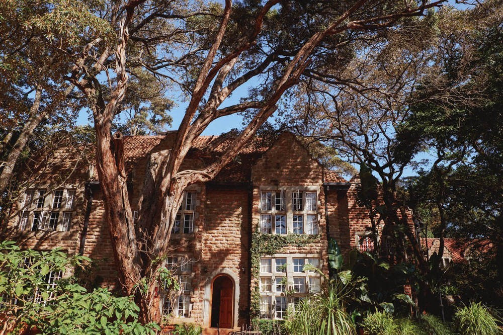 Kenya wedding photographer capturing couple at Giraffe Manor