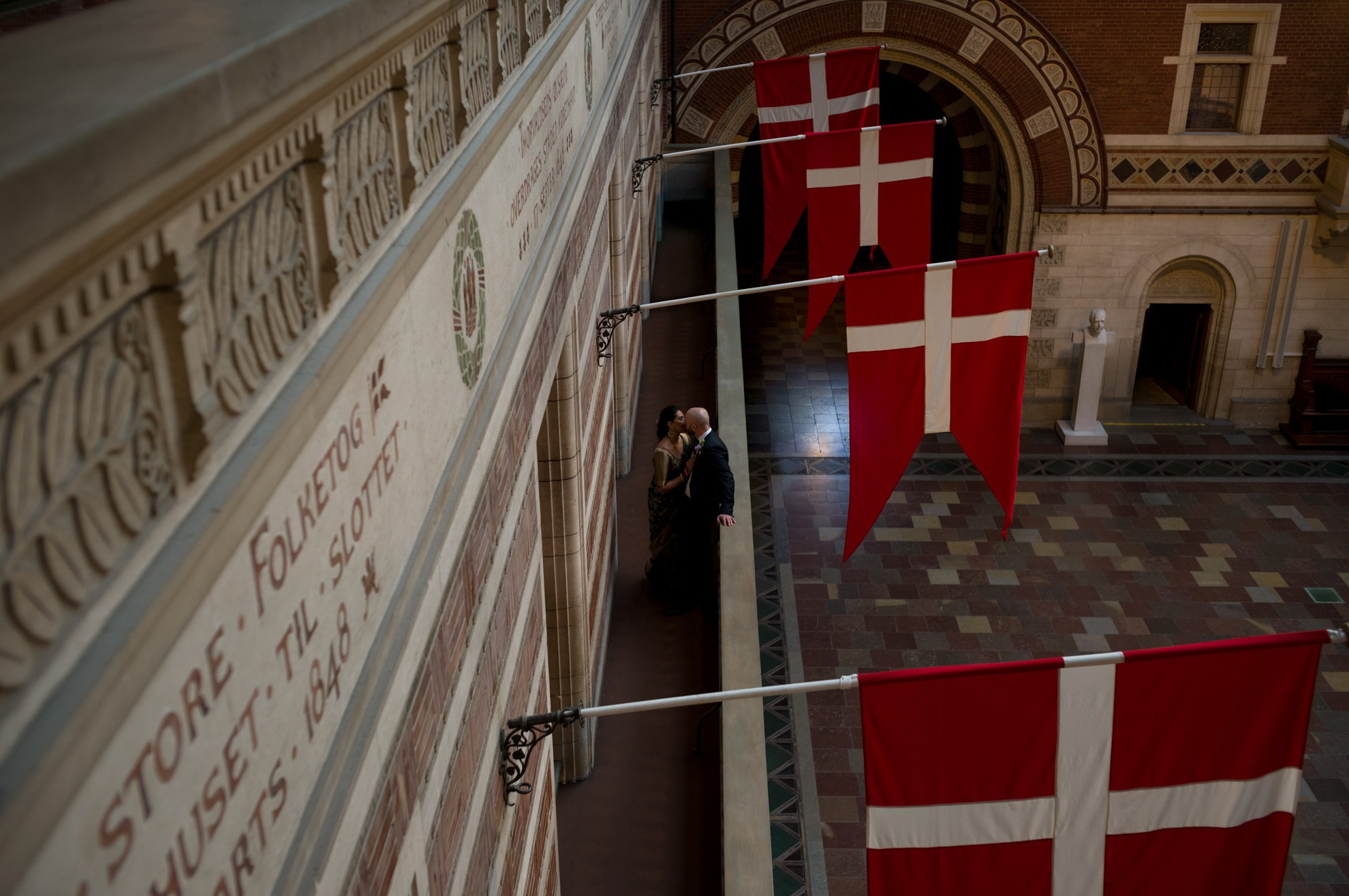 Romantic wedding moment in the grand halls of City Hall