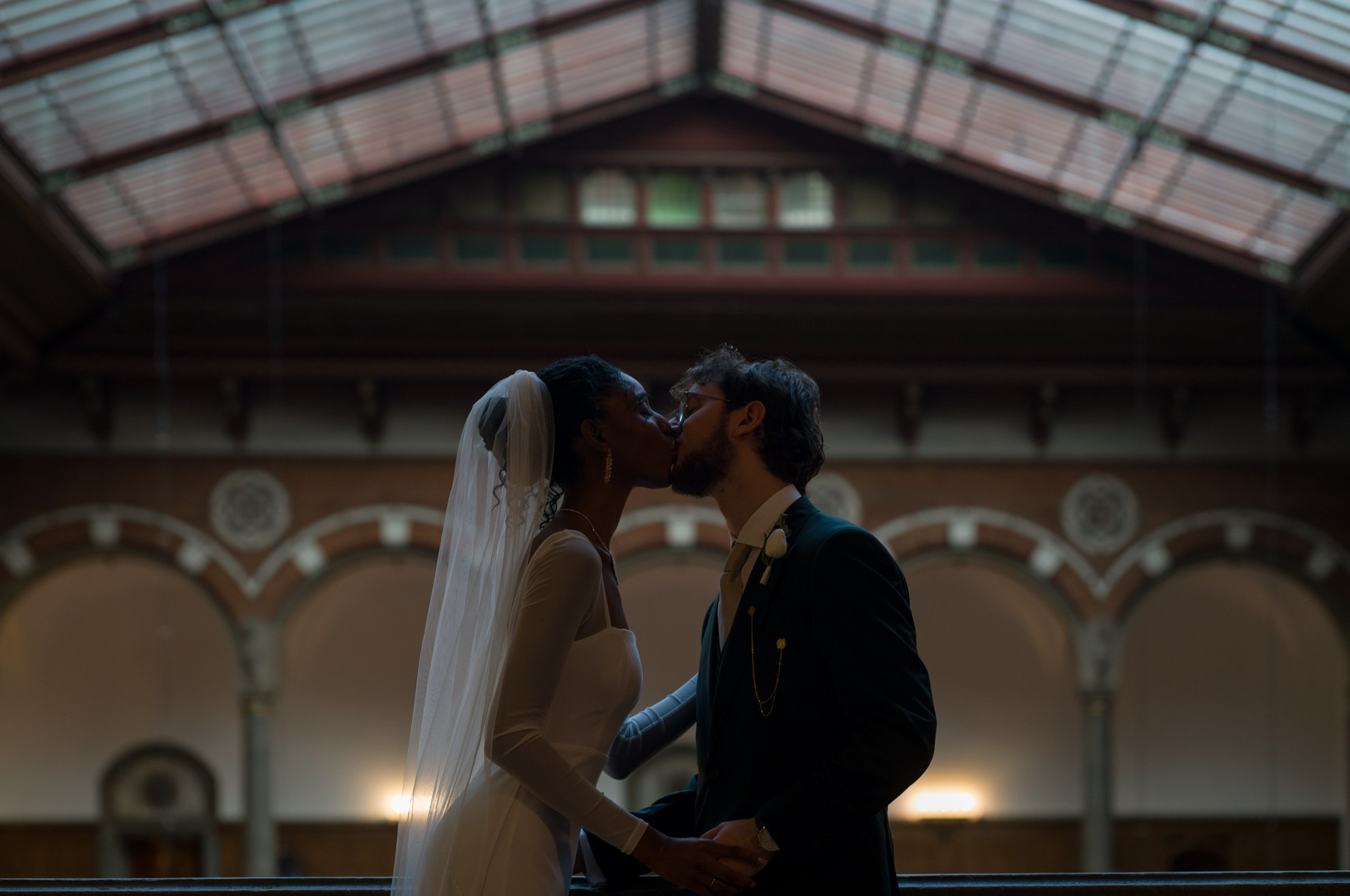 Romantic wedding moment in the grand halls of City Hall