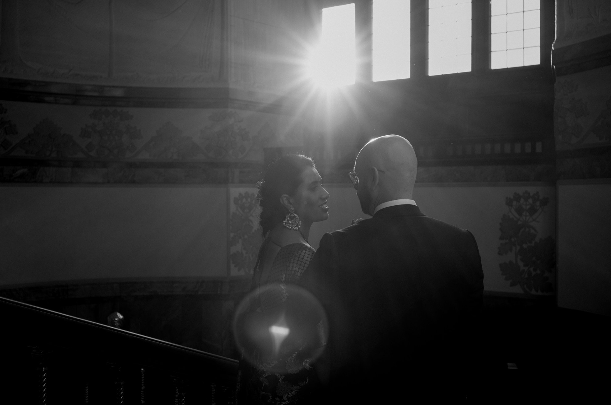 Romantic wedding moment in the grand halls of City Hall