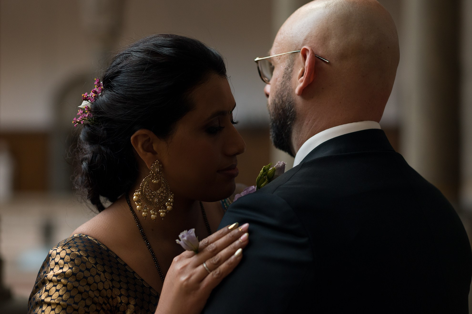 Bride and groom sharing a quiet moment inside Copenhagen City Hall