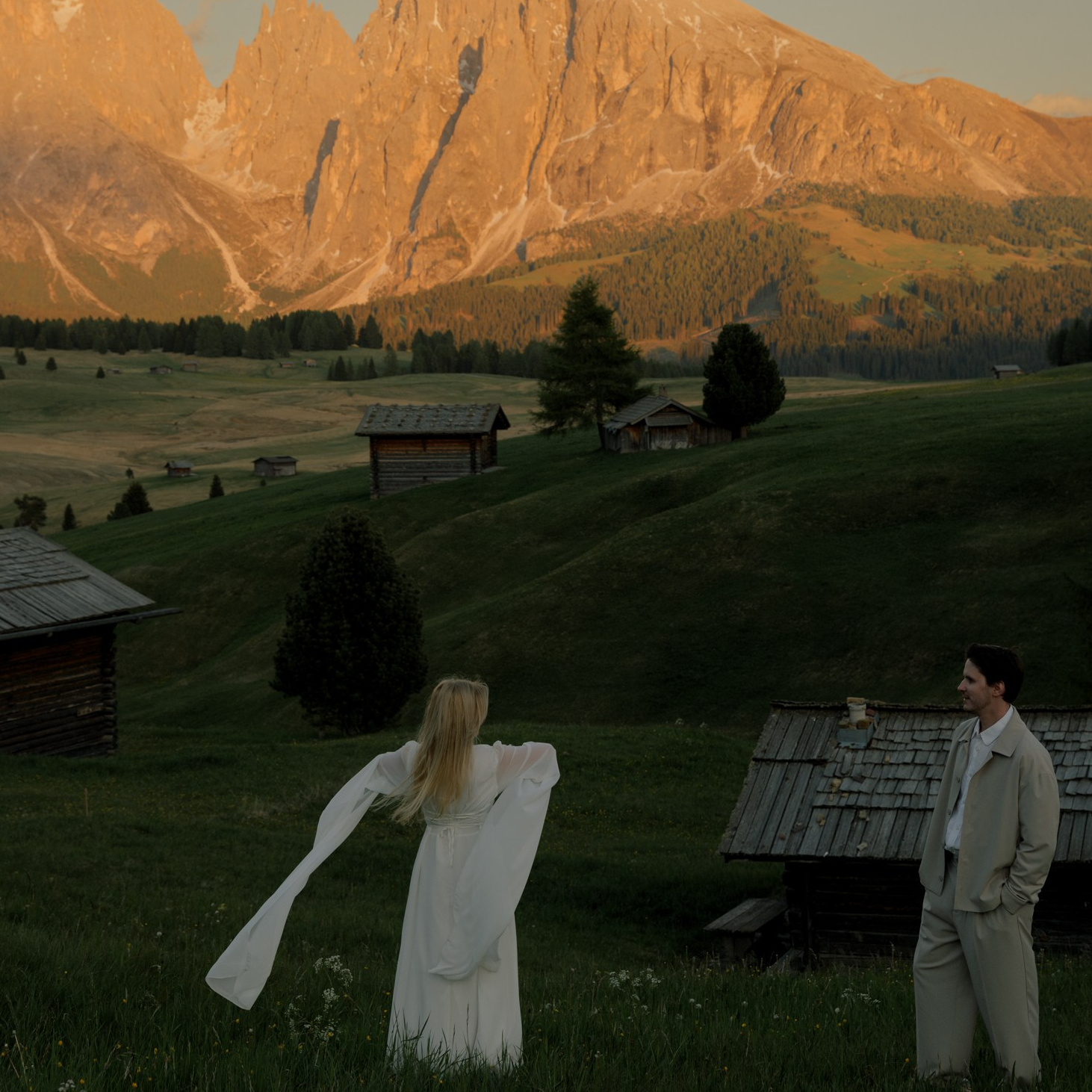Romantic elopement in the Dolomites with couple exchanging vows surrounded by dramatic mountain peaks