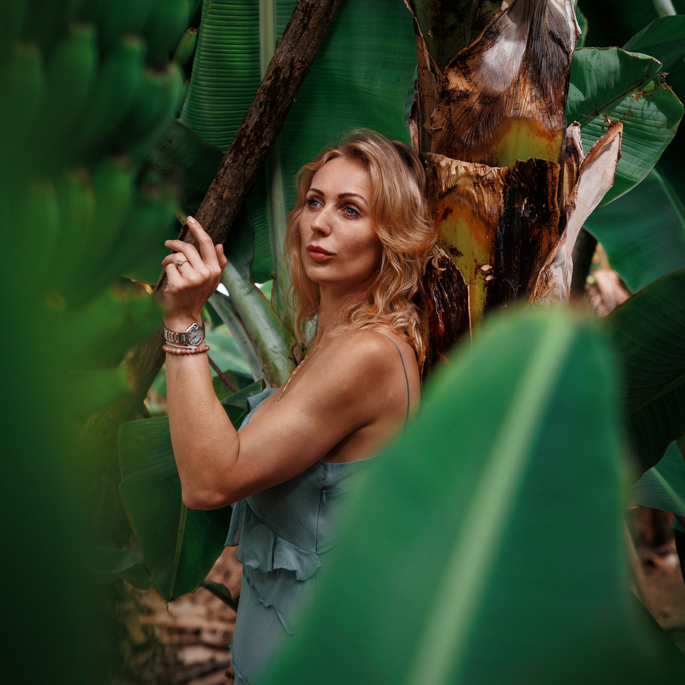 Best Vibrant solo traveler portrait in Arucas Banana Plantation surrounded by lush banana leaves