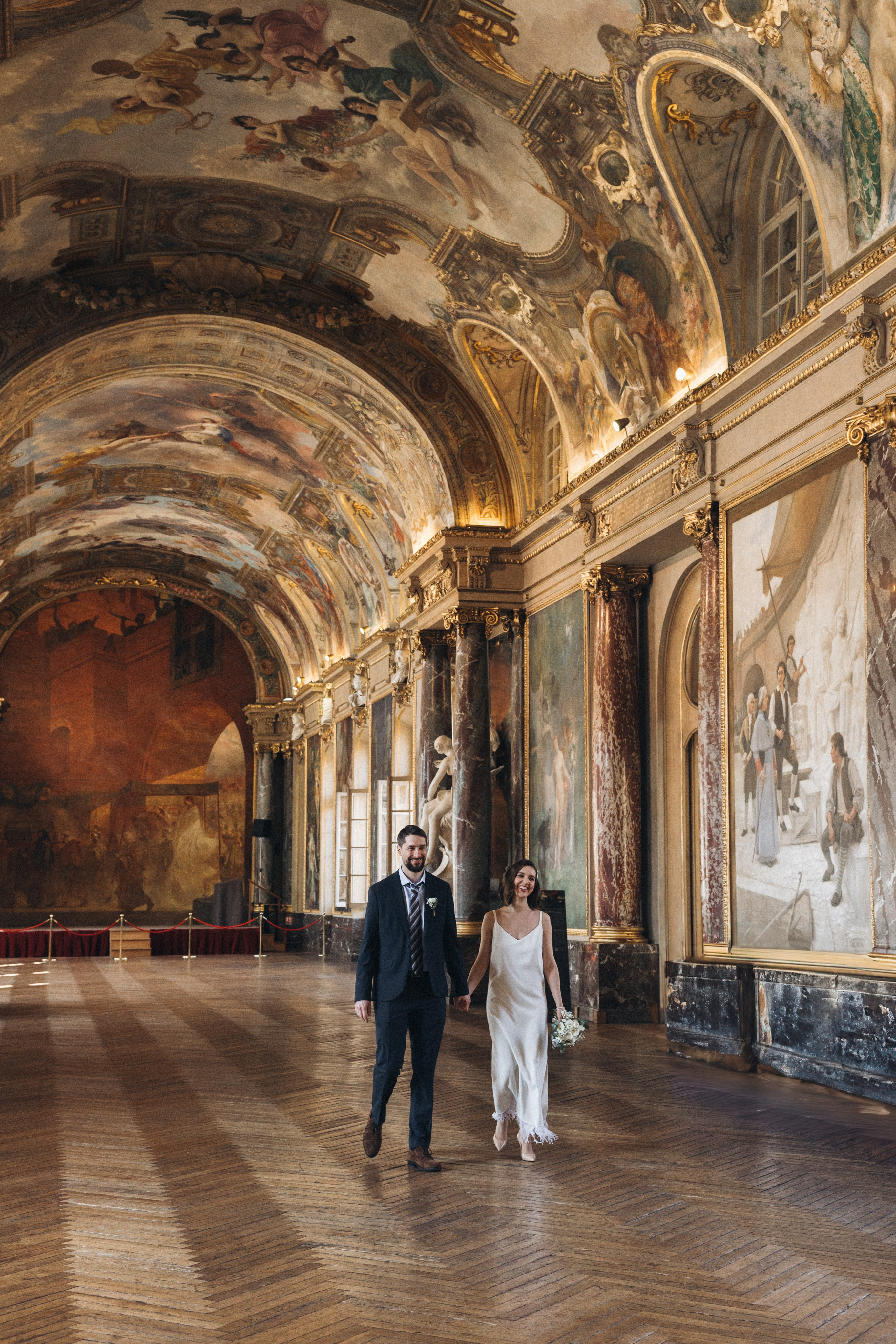 Couple in the Salle des Illustres, the grand painted hall of the Capitole in Toulouse