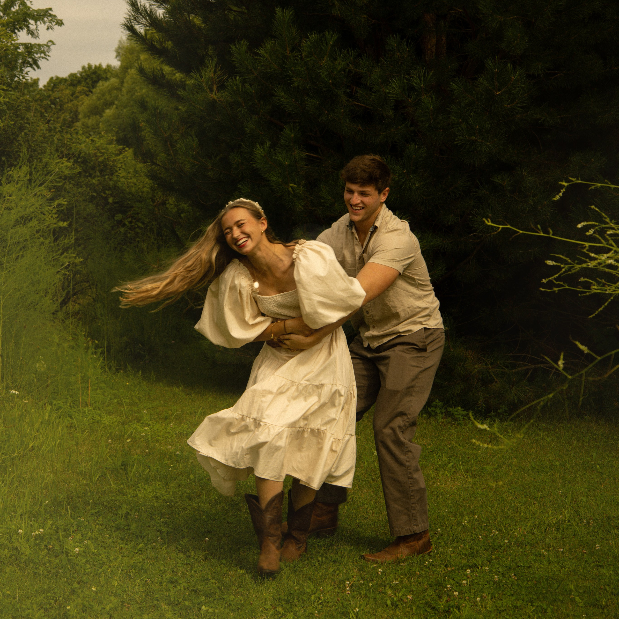 Oshkosh, WI bride and groom running of into nature.
