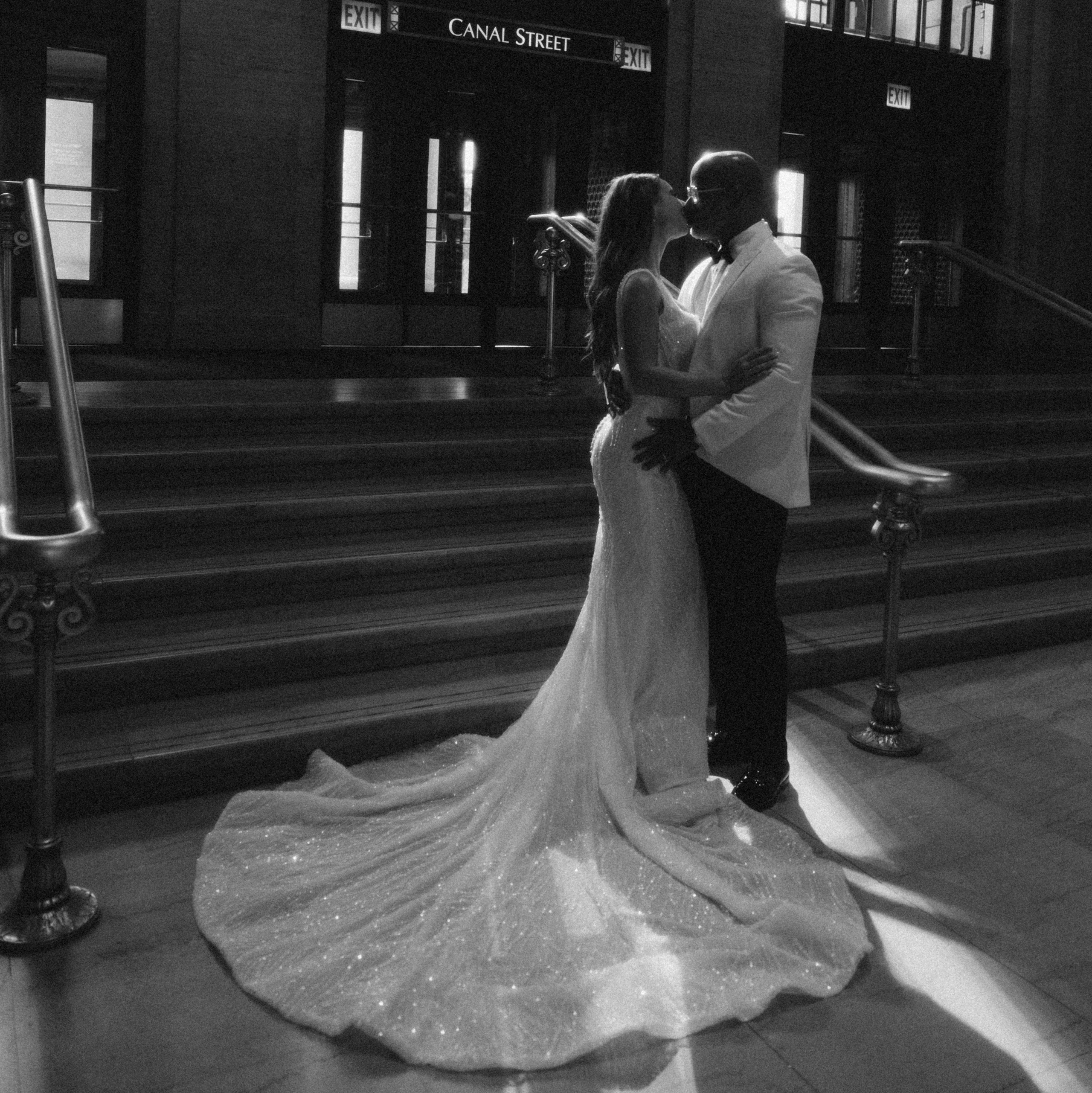Bride walking down elegant staircase during intimate wedding in Chicago