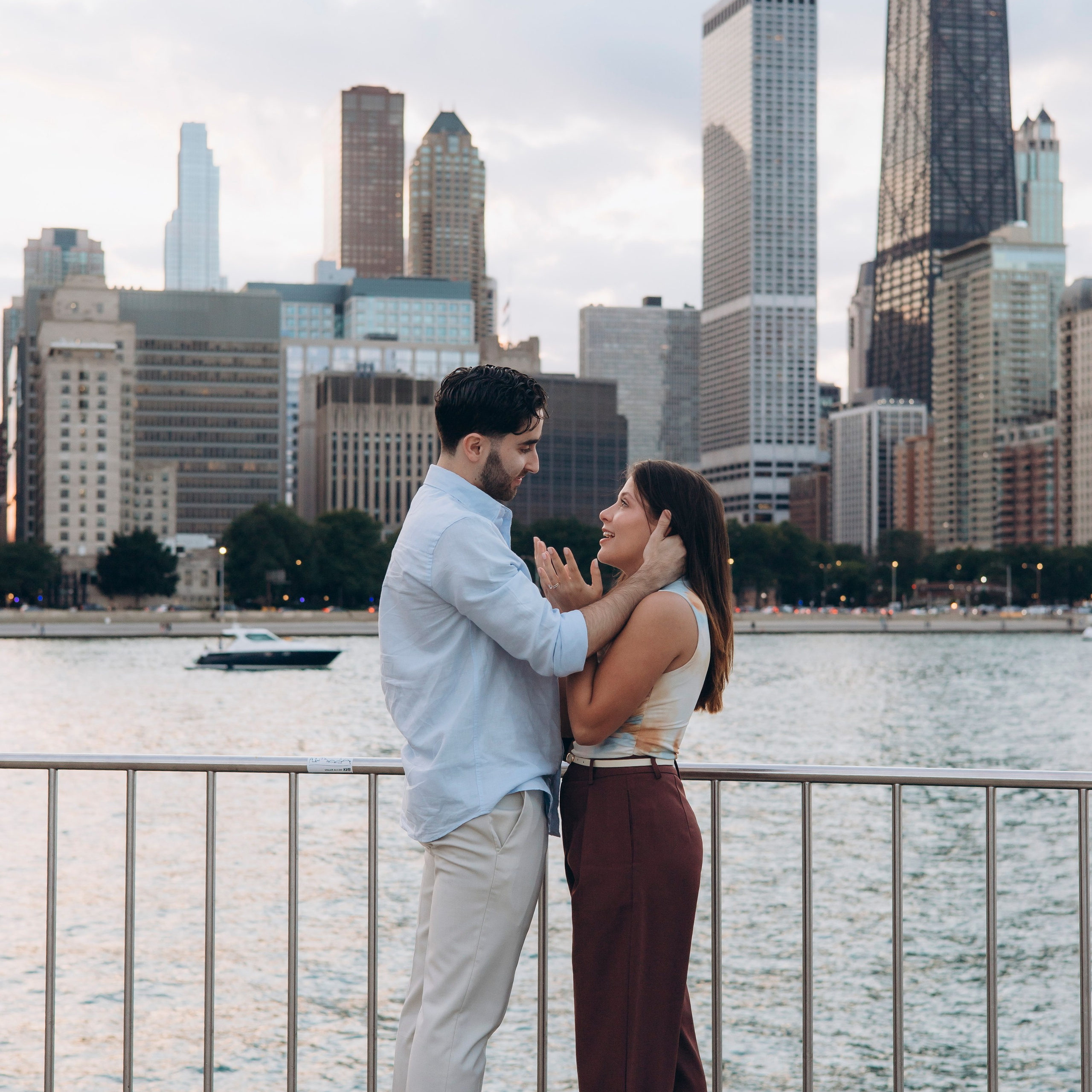 Engagement photo at Milton Lee Olive Park with the Chicago skyline in the background.