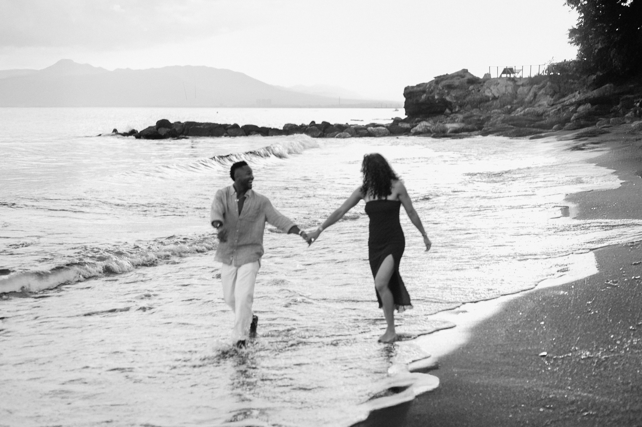 destination wedding in Valencia, Spain with couple walking along the beach near the Mediterranean coastline