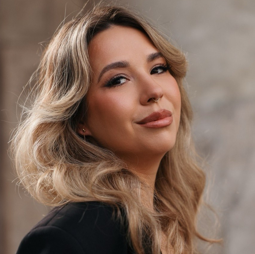 a profile of a girl in a black dress from zara with blond straight hair