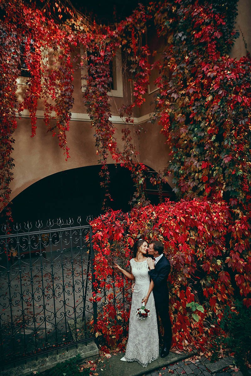 Candid wedding photography — Turkish bride is lifted joyfully by her Czech groom during their wedding celebration at Grand Mark Prague hotel — Kurt Vinion Photography