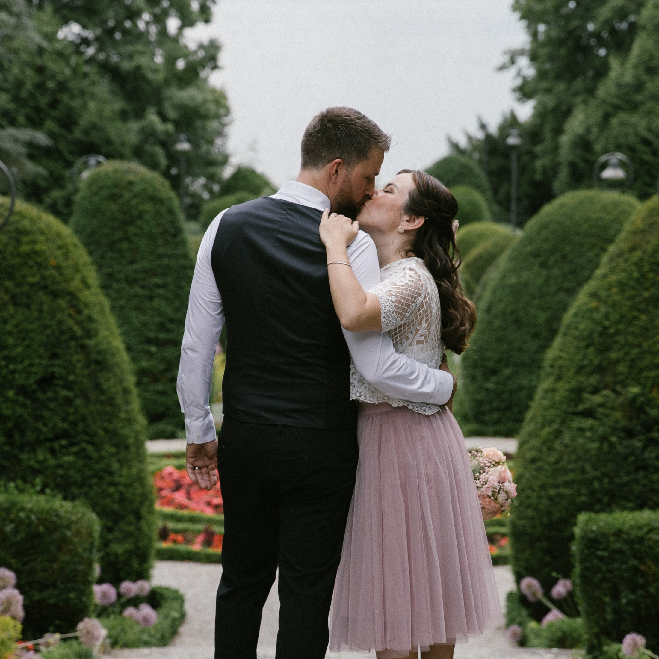 Couple embracing in garden at Villa Leopold am See, Lindau