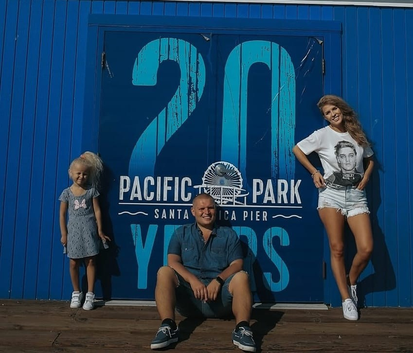 Family laughing together on Santa Monica Beach, ideal for family photoshoots in Los Angeles