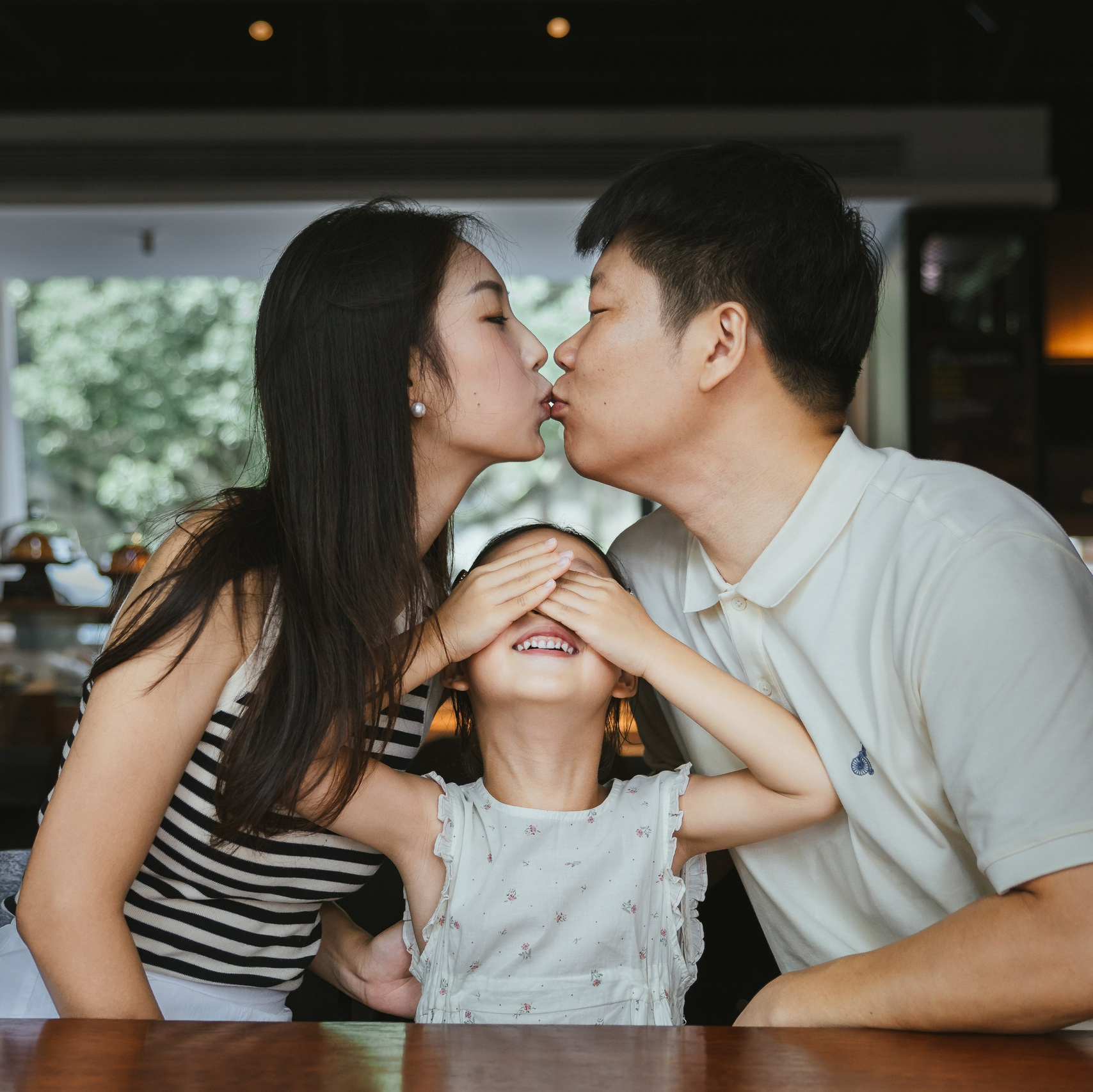 I took photos of a family of three visiting Shanghai at a street-side café.