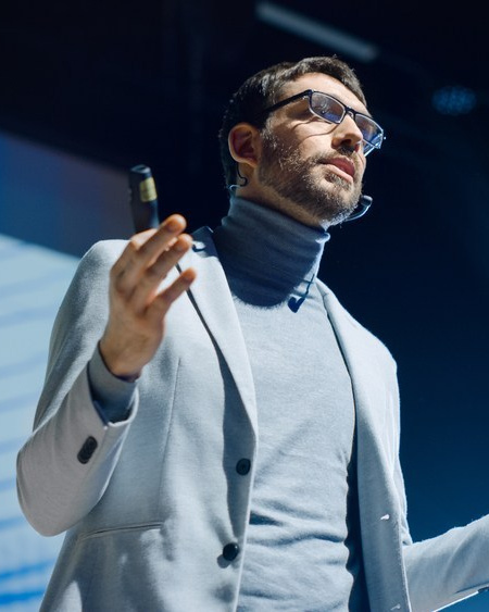 Speaker presenting on stage during a corporate event video production in Dubai