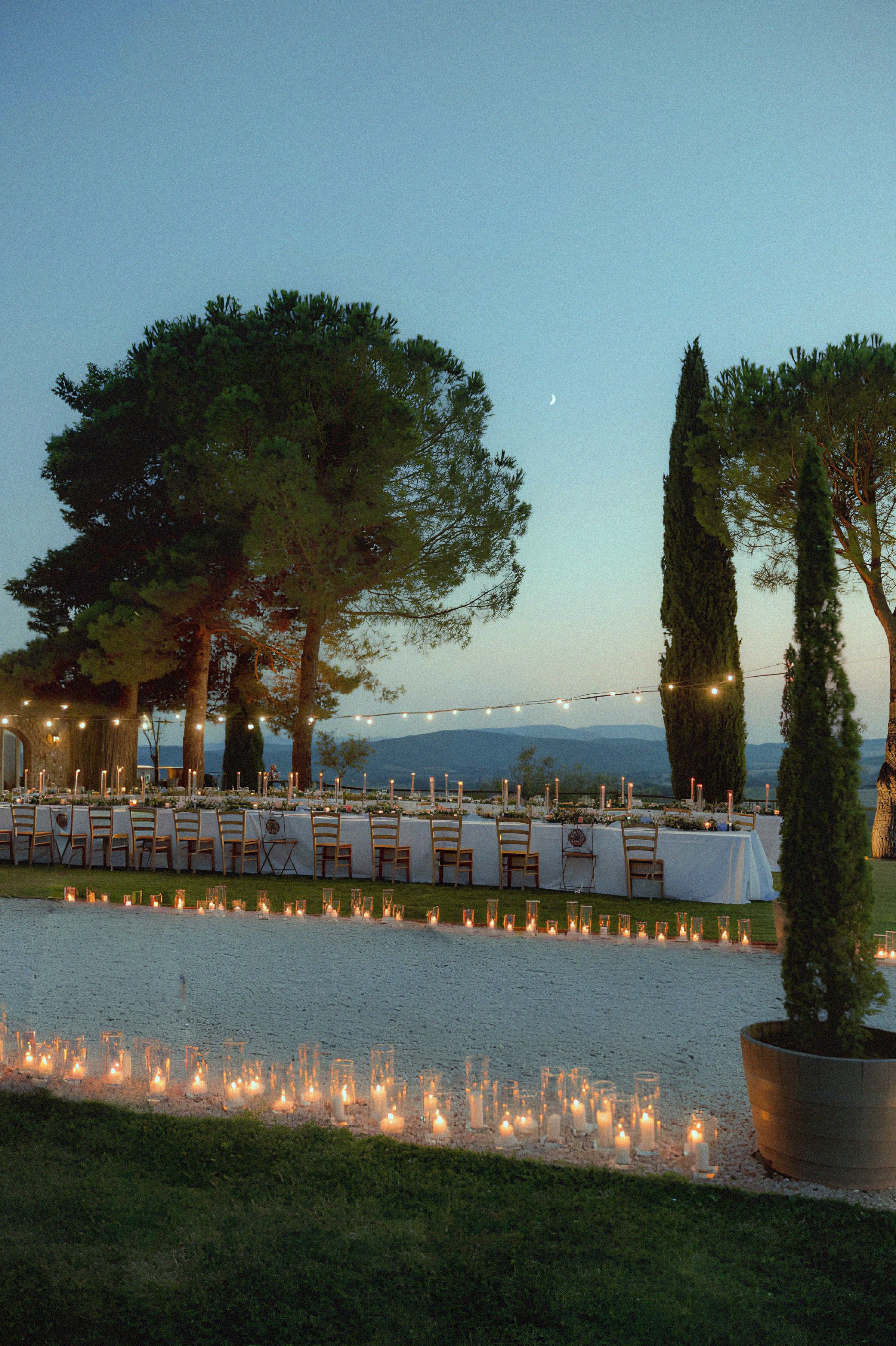 Long dinner table with candles at Amanruya Bodrum