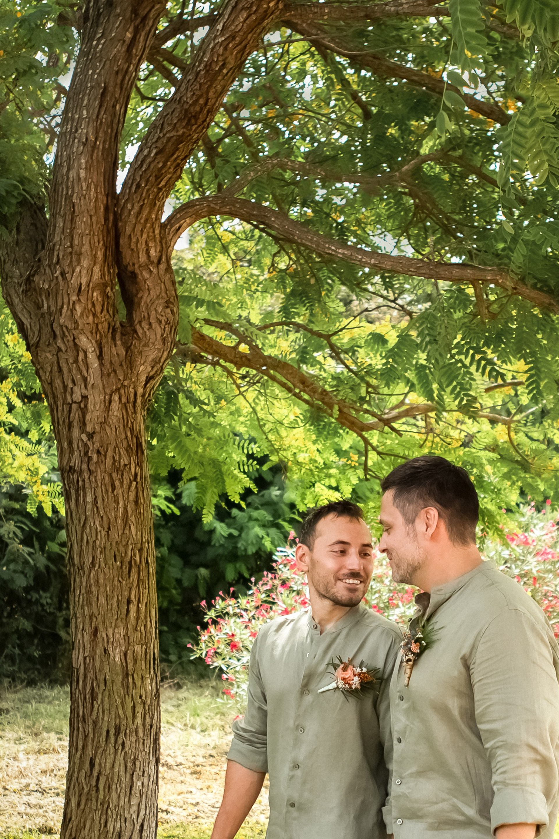 Same-sex newlywed couple overlooking the Mediterranean
