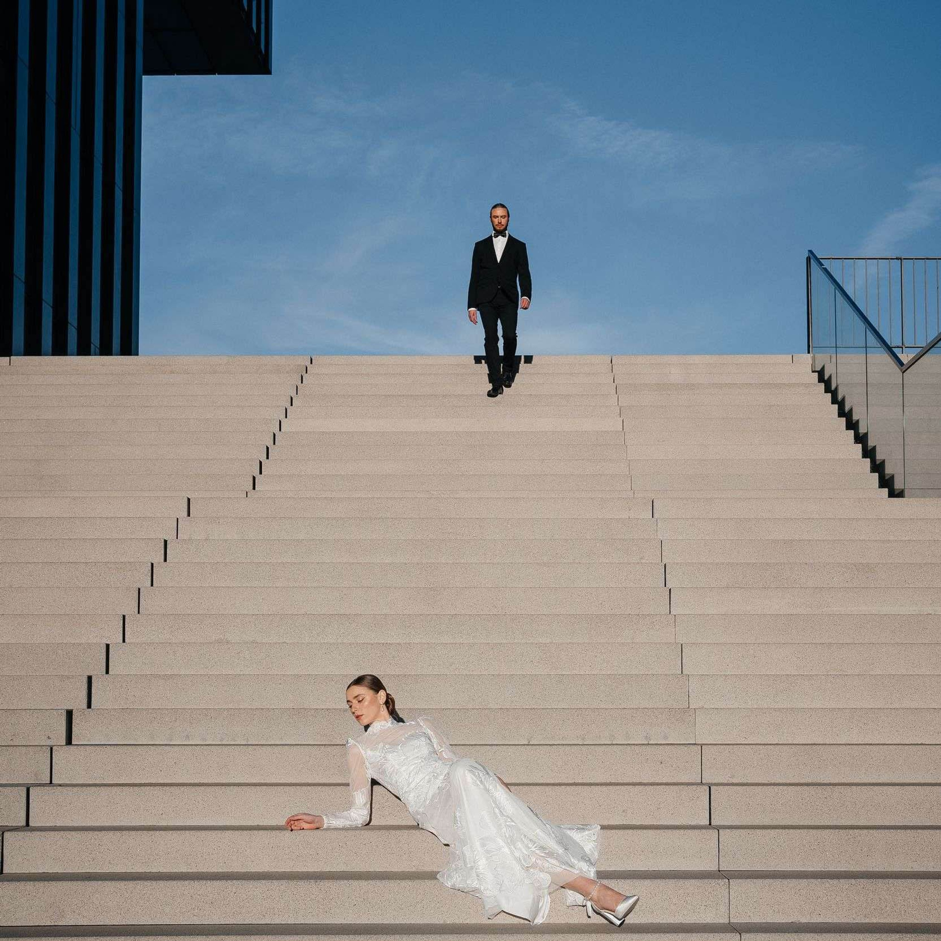 bride and groom at stairs hilton hotel