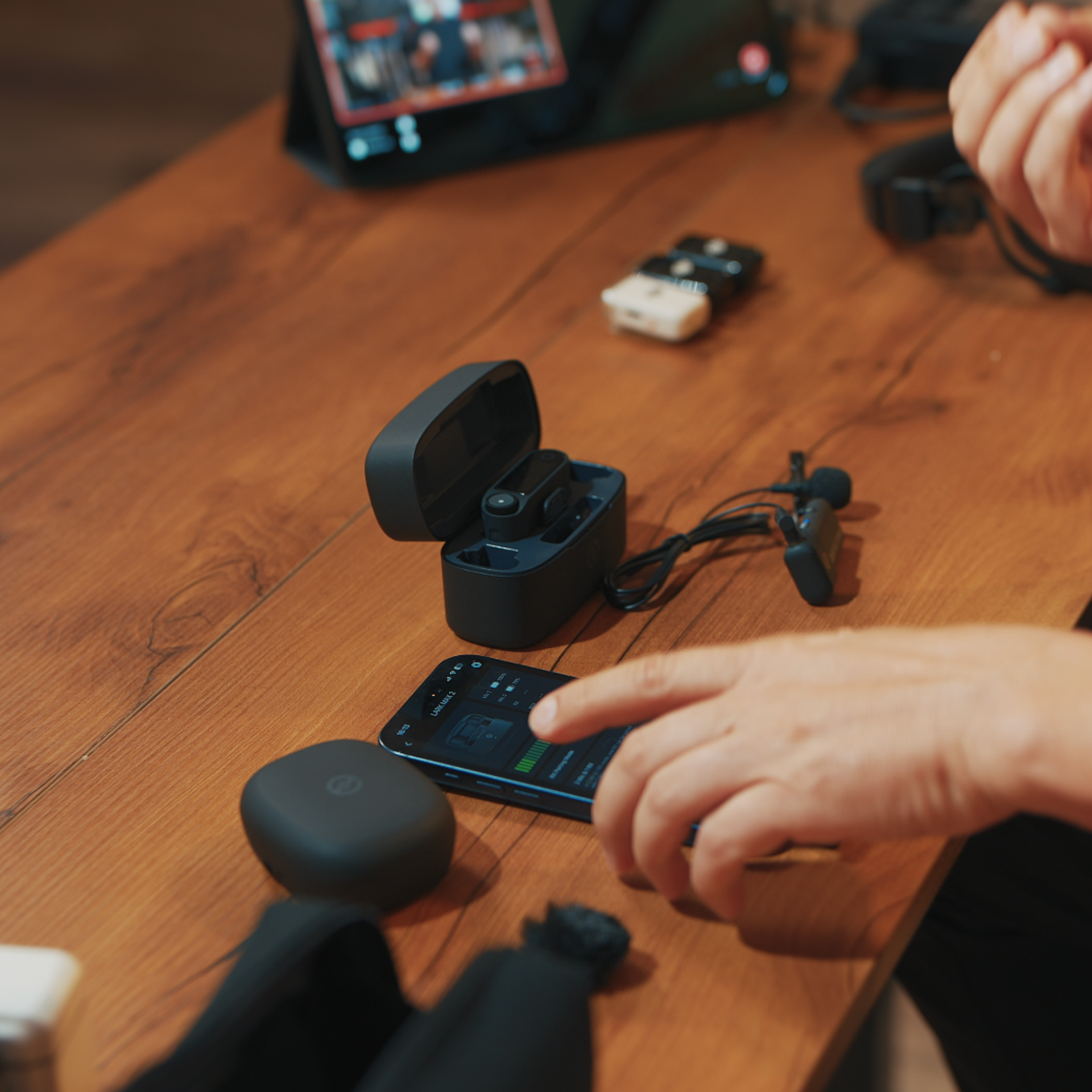 Podcast recording workflow on a studio table at ProStudio1 Hollywood, FL — microphones and setup for interviews, brand podcasts, and content creation.
