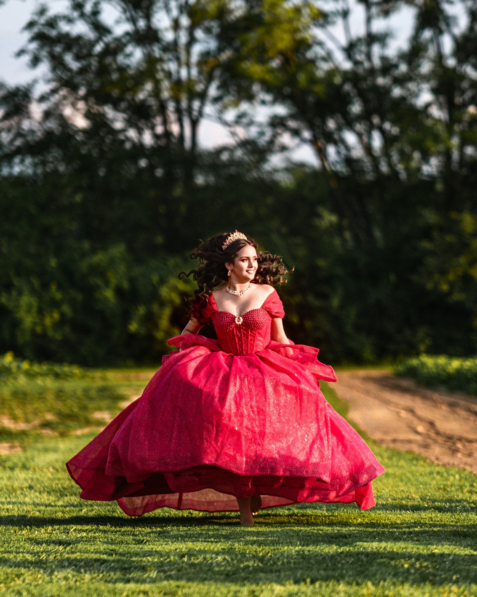 Editorial fine art quinceañera photoshoot in dramatic red gown at local flower farm Central Indiana