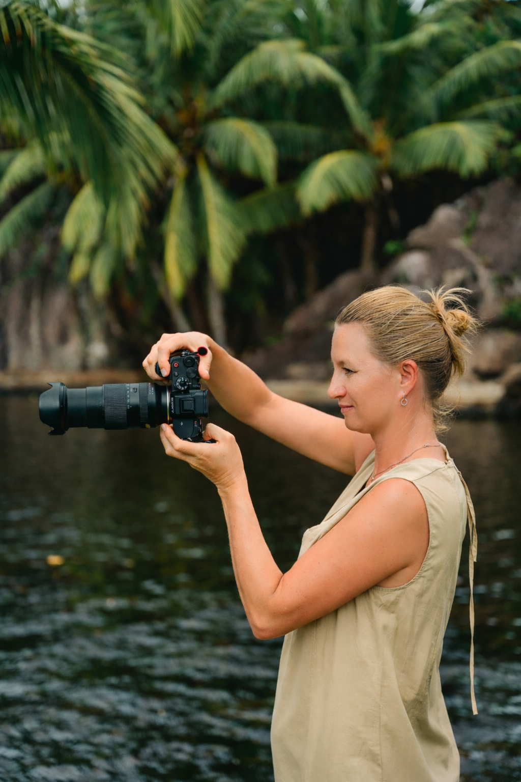 Irina Zoteeva professional photographer holding camera, artistic portrait and brand photographer in Solihull Birmingham