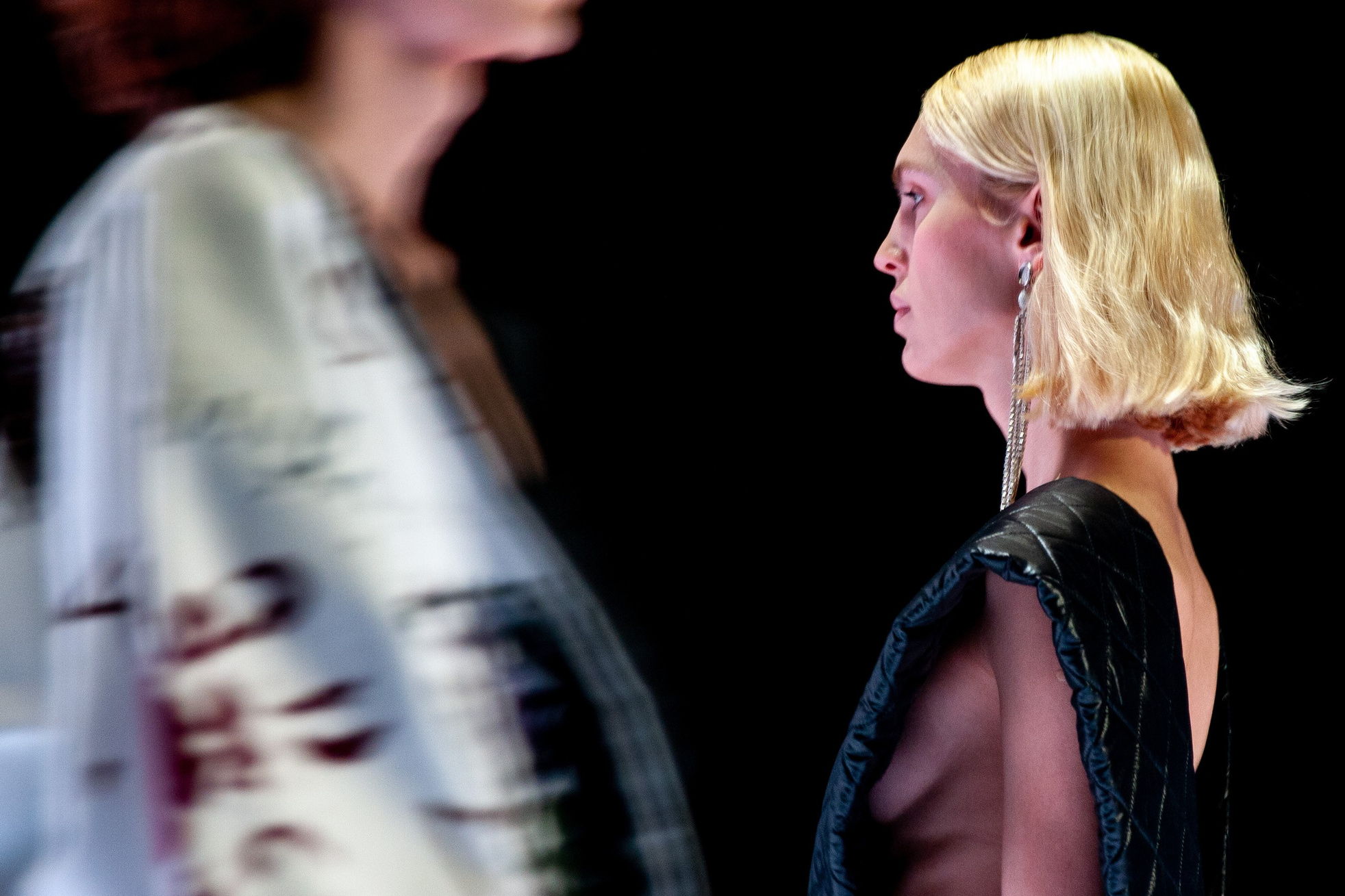 Fashion editorial shot from Rome Fashion Week, highlighting innovative textures and movement.