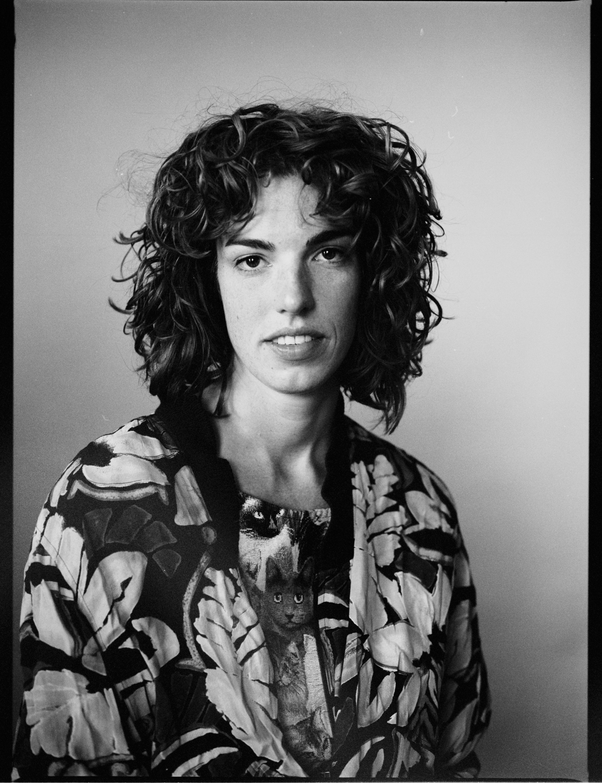 Photo portrait of a woman with a cat, medium film photography.