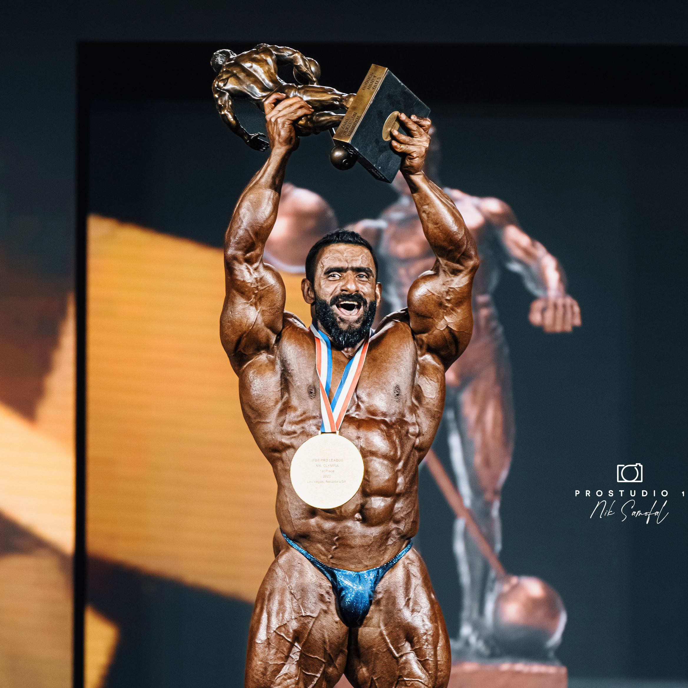 Hadi Choopan is a professional bodybuilder from Iran, who is widely considered to be one of the best bodybuilders in the world. He was born on November 10, 1988, in Babol, Iran. Choopan has competed in several major bodybuilding competitions, including the Olympia, where he placed third in the Men's Open category in 2020. Choopan is known for his impressive physique, which is characterized by his well-developed legs and overall muscularity. He is often referred to by his nickname "The Persian Wolf" and has a large following on social media, where he shares his training and diet tips with his fans. Choopan's rise to fame in the bodybuilding world has been a source of inspiration for many young people in Iran and around the world, and he is widely regarded as one of the most successful athletes from Iran in recent years.