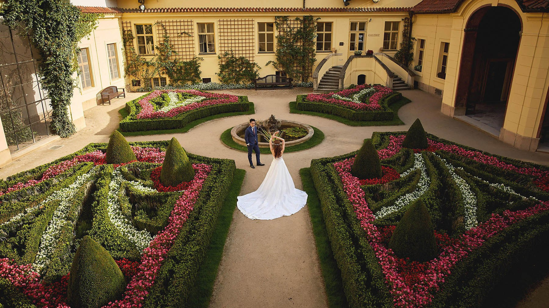 Bird's-eye view of a bride posing in Vrtba Garden, Prague.