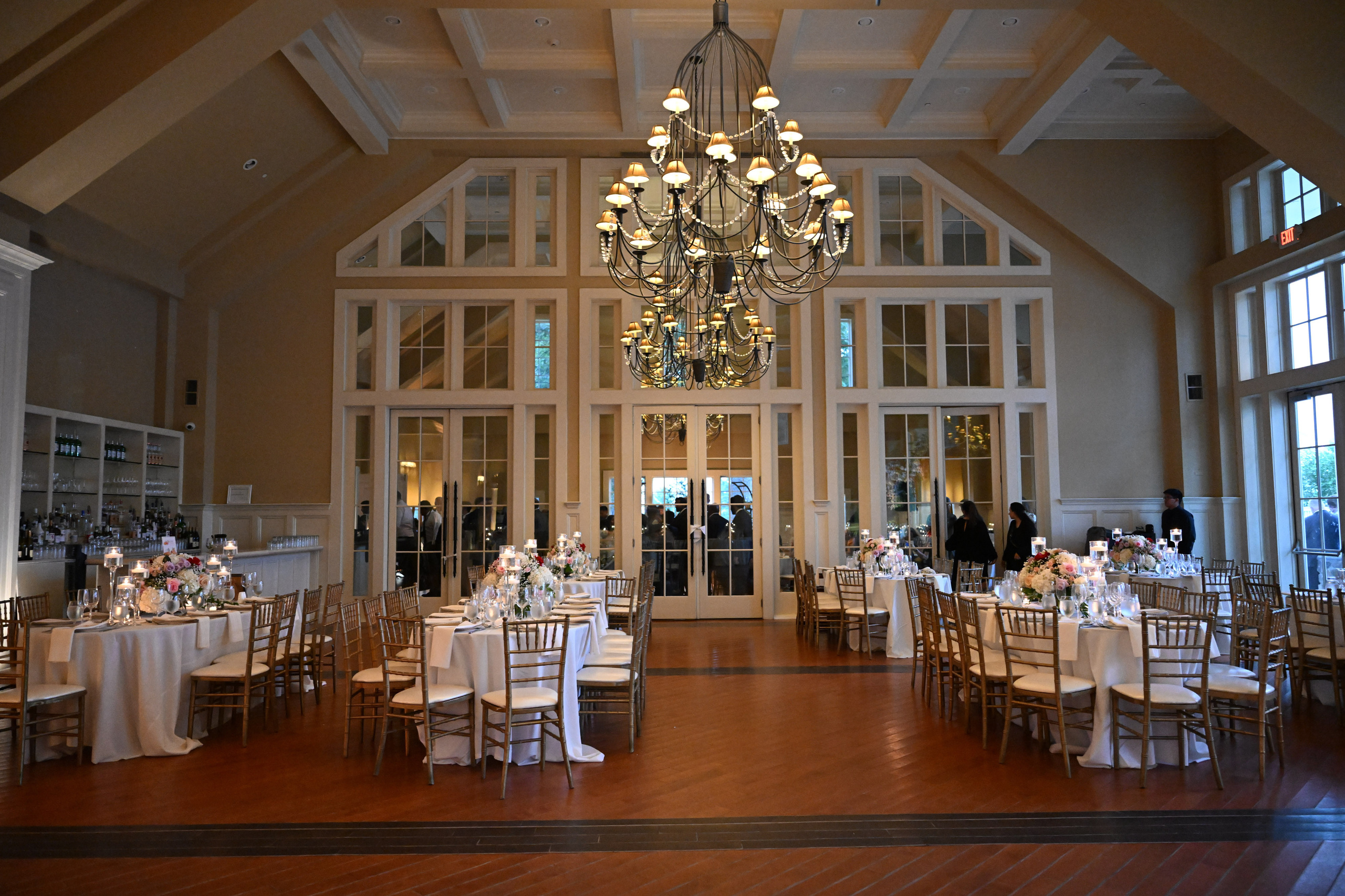 a large room with a chandel and a chandel