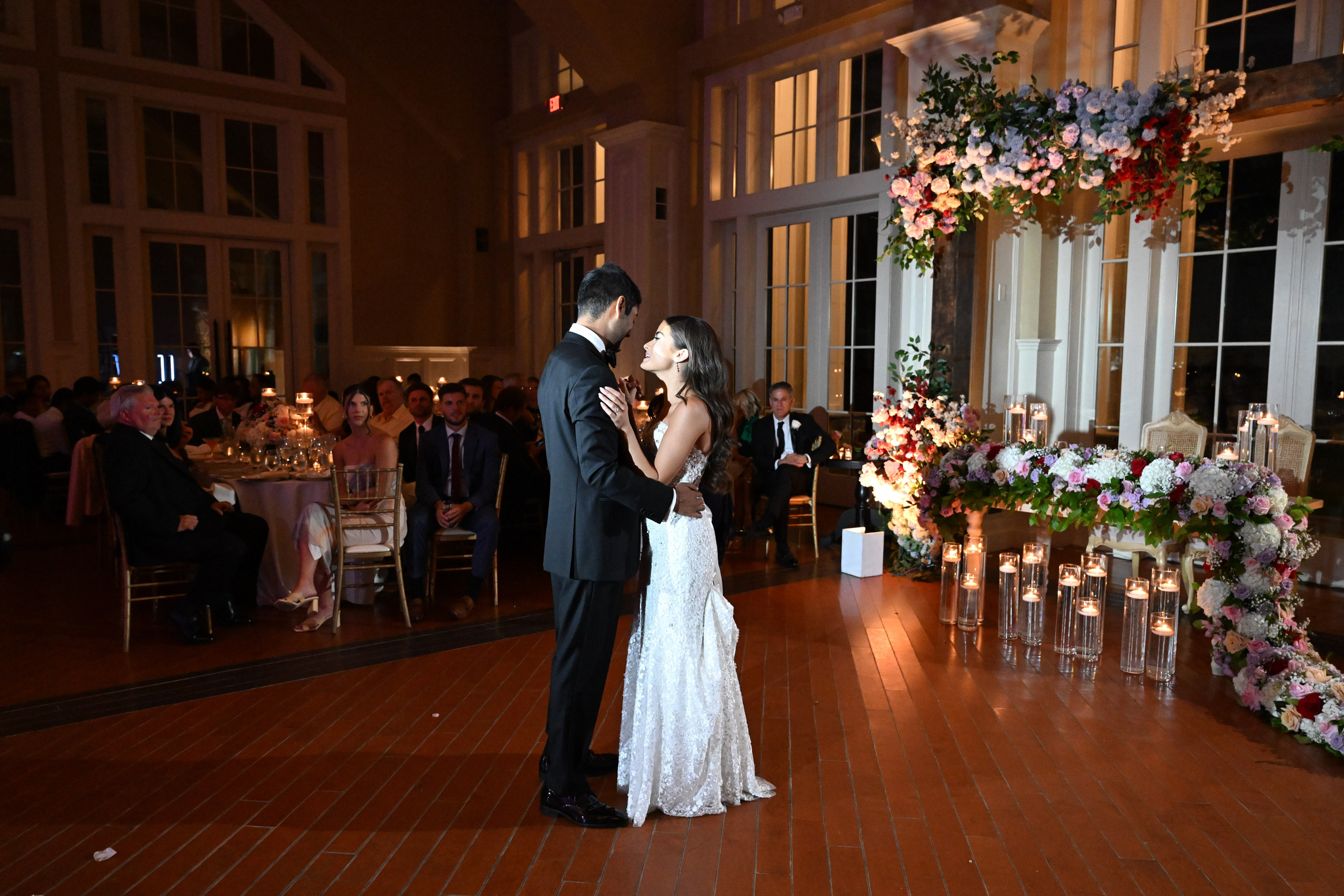 a bride and groom sharing a kiss at their wedding reception