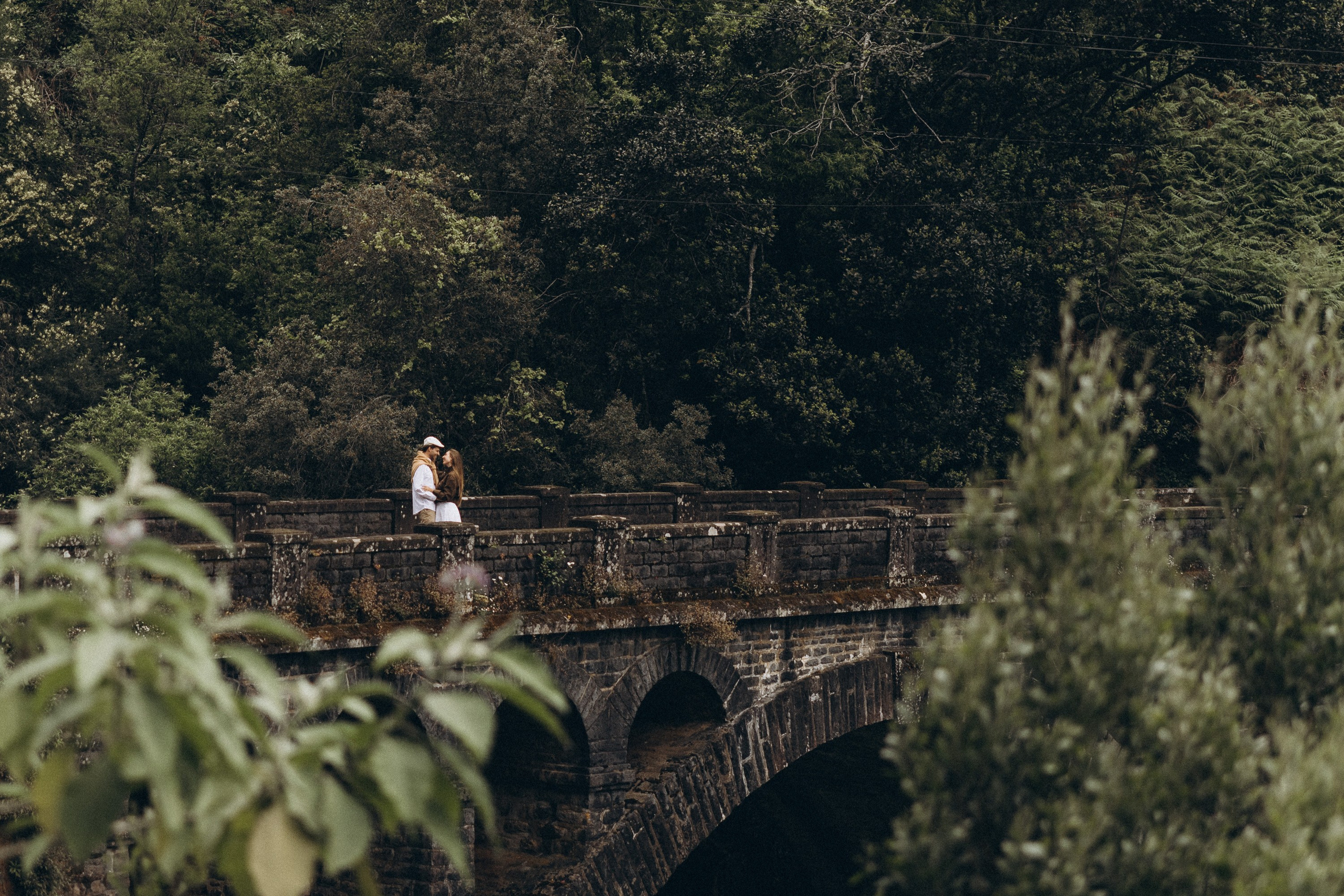 Cinematic couple photography in Madeira with golden light and dramatic coastal scenery.