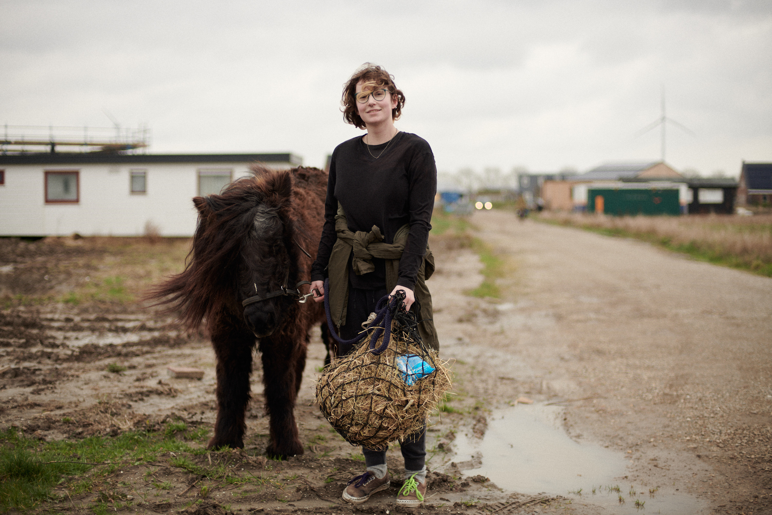 A documentary photography made in Almere, a young woman with the horse, was captured next to my photo studio.