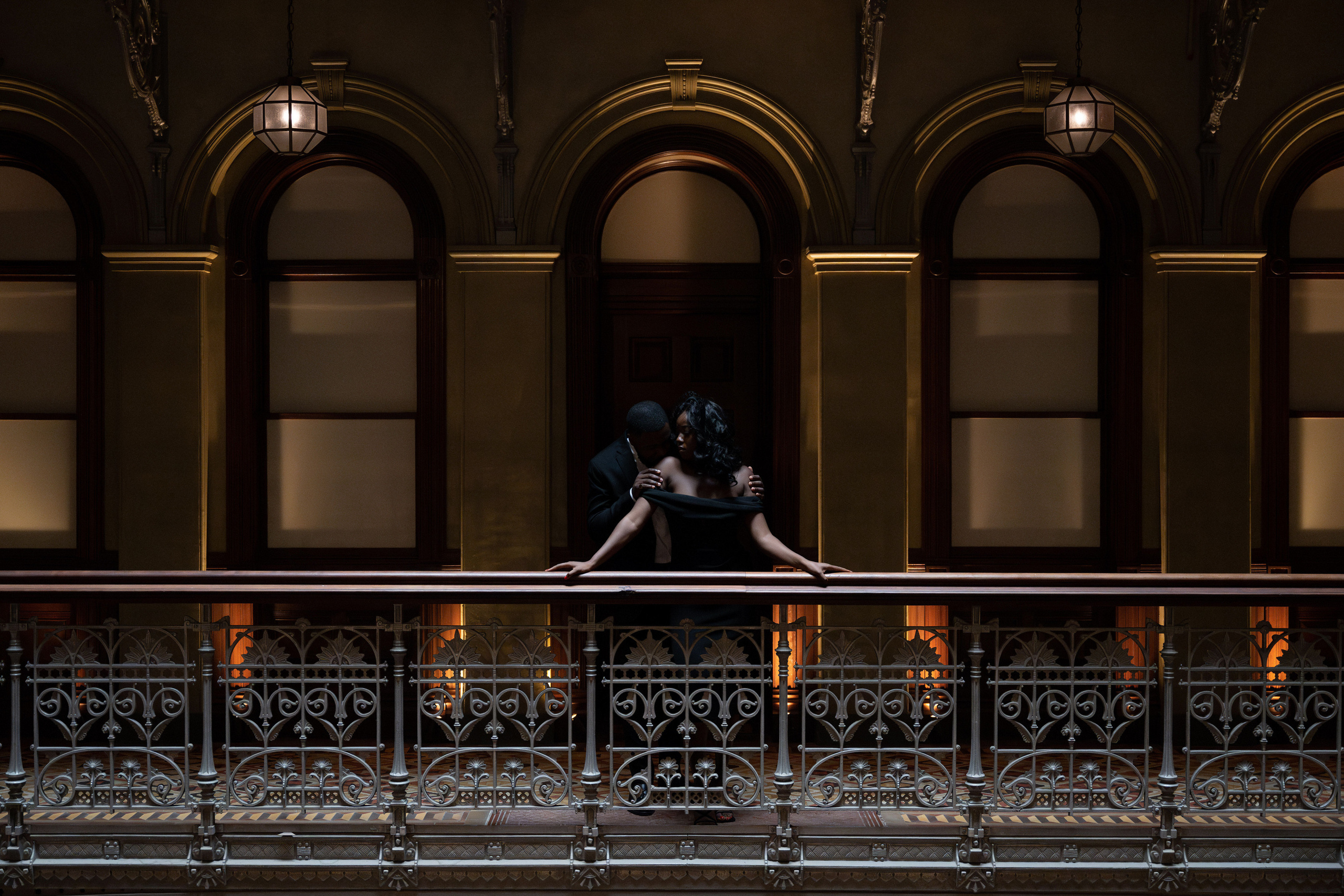 a woman is taking a picture of herself on a balcony