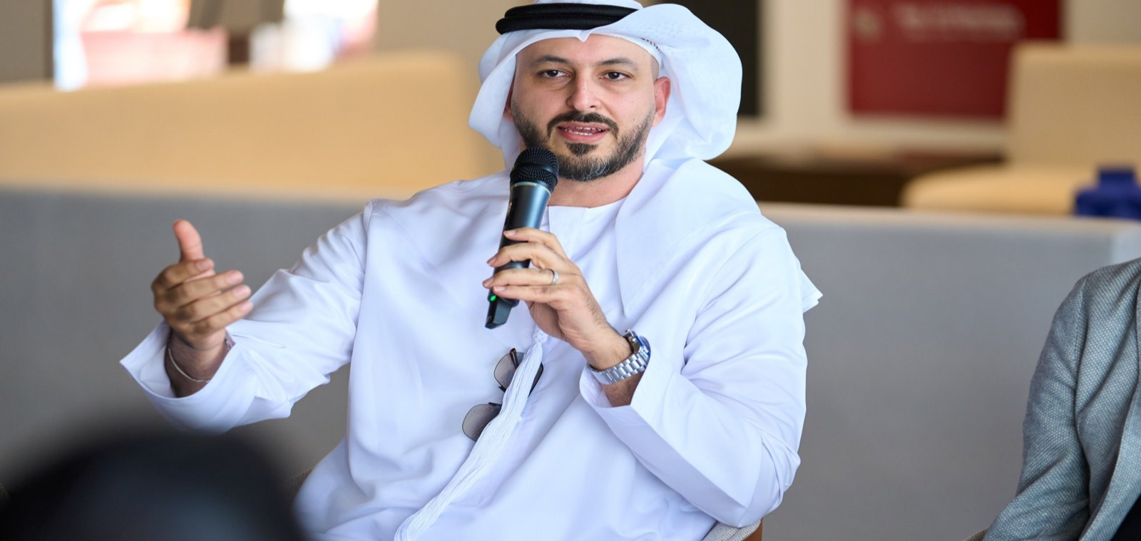Corporate speaker taking part in a recorded panel discussion at a business event