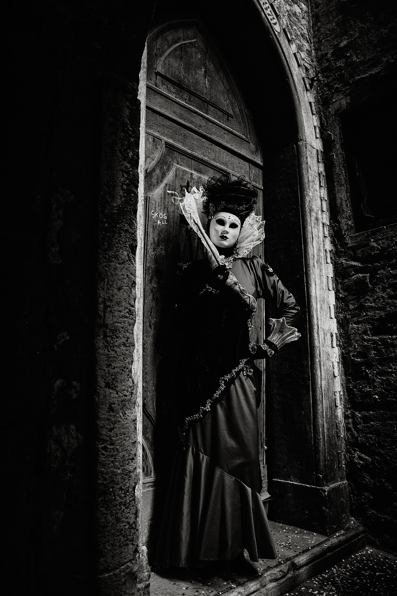 A group of participants wearing historical costumes and masks representing different periods in Venetian history.